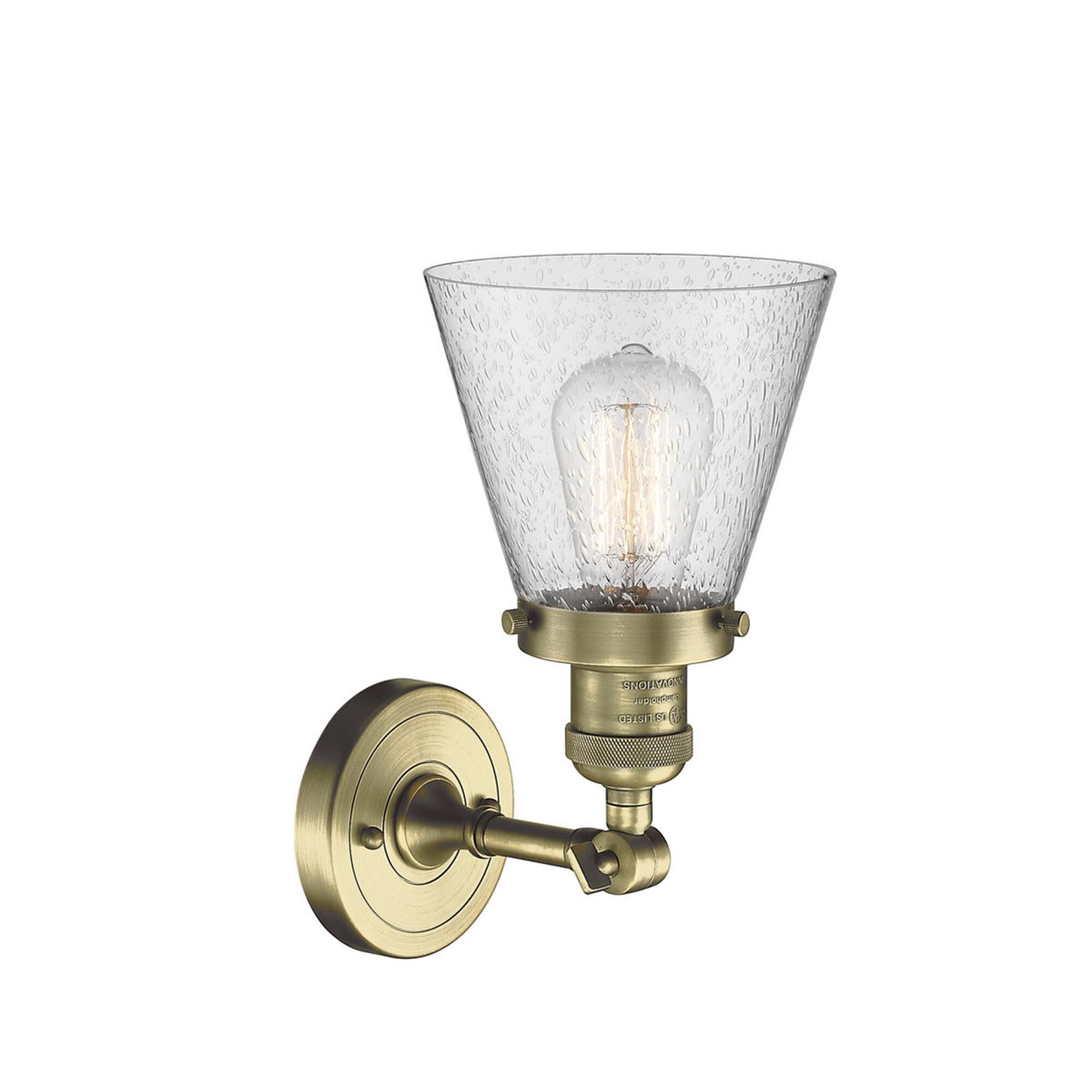 Shown in Antique Brass finish and Seedy glass