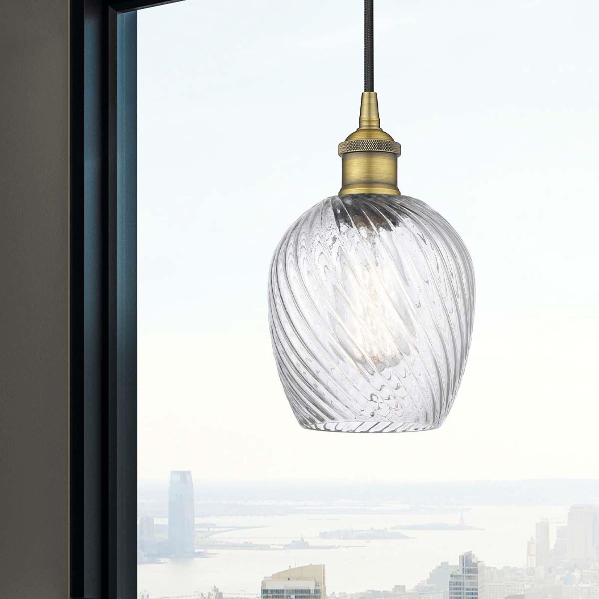 Shown in Brushed Brass finish and Clear Spiral Fluted Salina glass