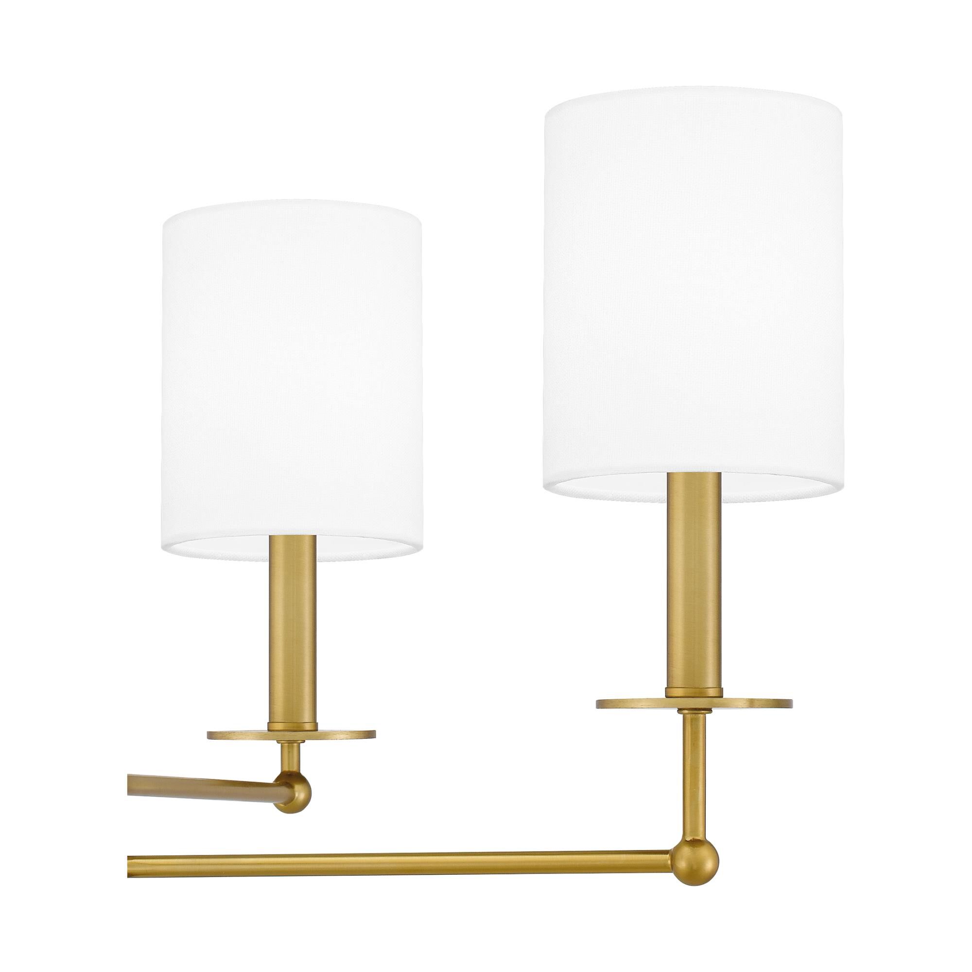 Shown in Aged Brass finish and White Linen shade