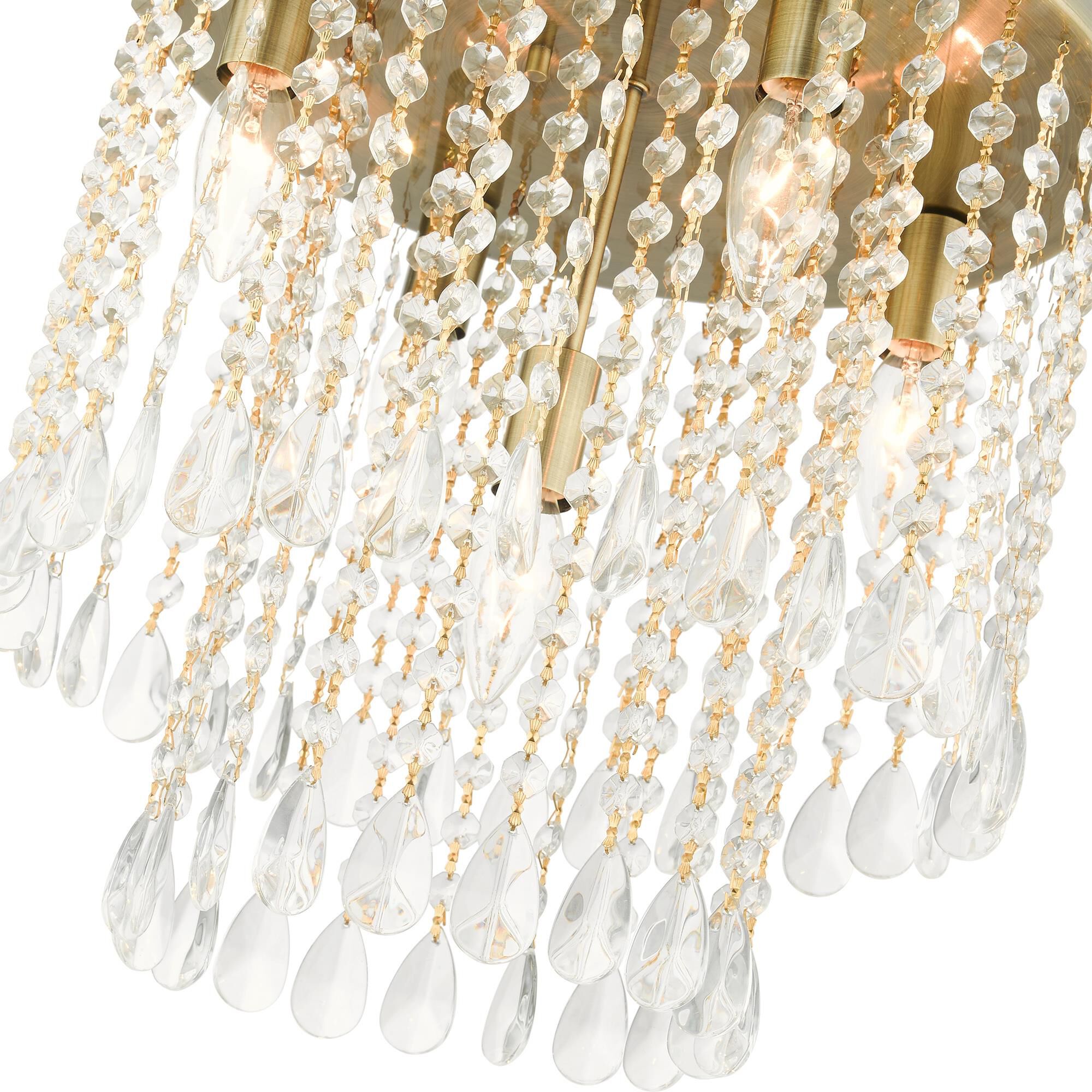 Shown in Antique Brass finish and Hand Assembled Crystal Shade glass