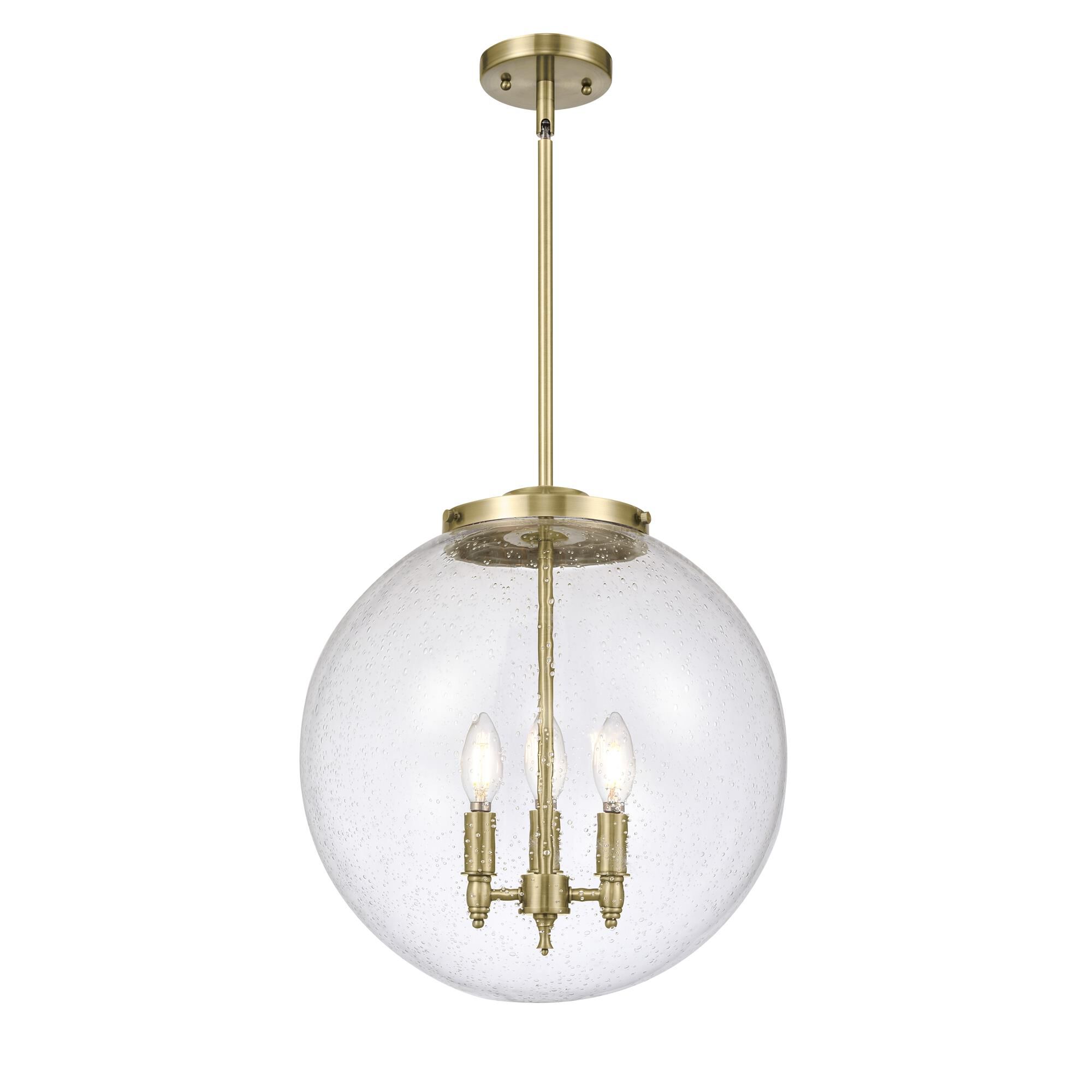 Shown in Antique Brass finish and Seedy glass