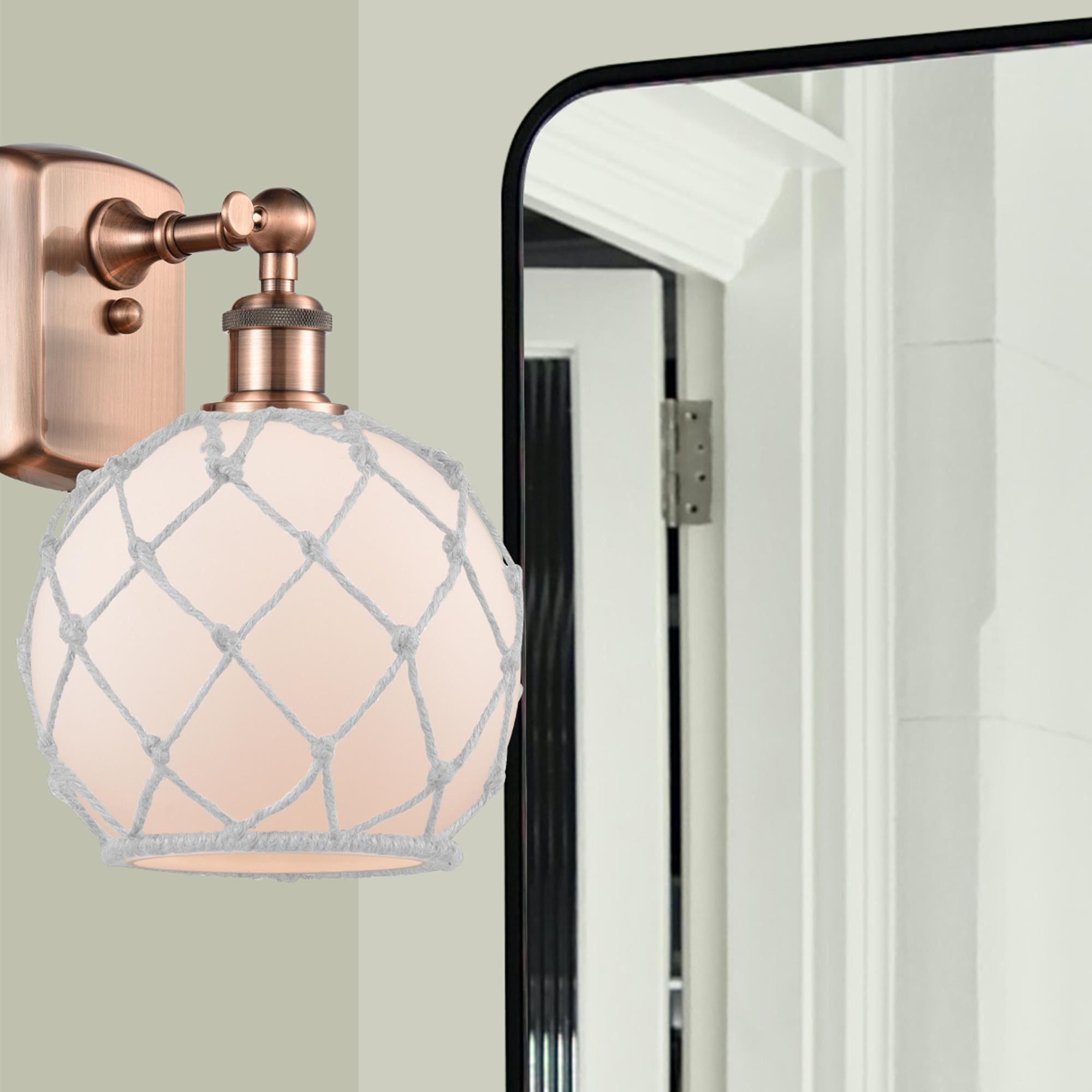 Shown in Antique Copper finish and Sphere glass and Glass And Rope shade