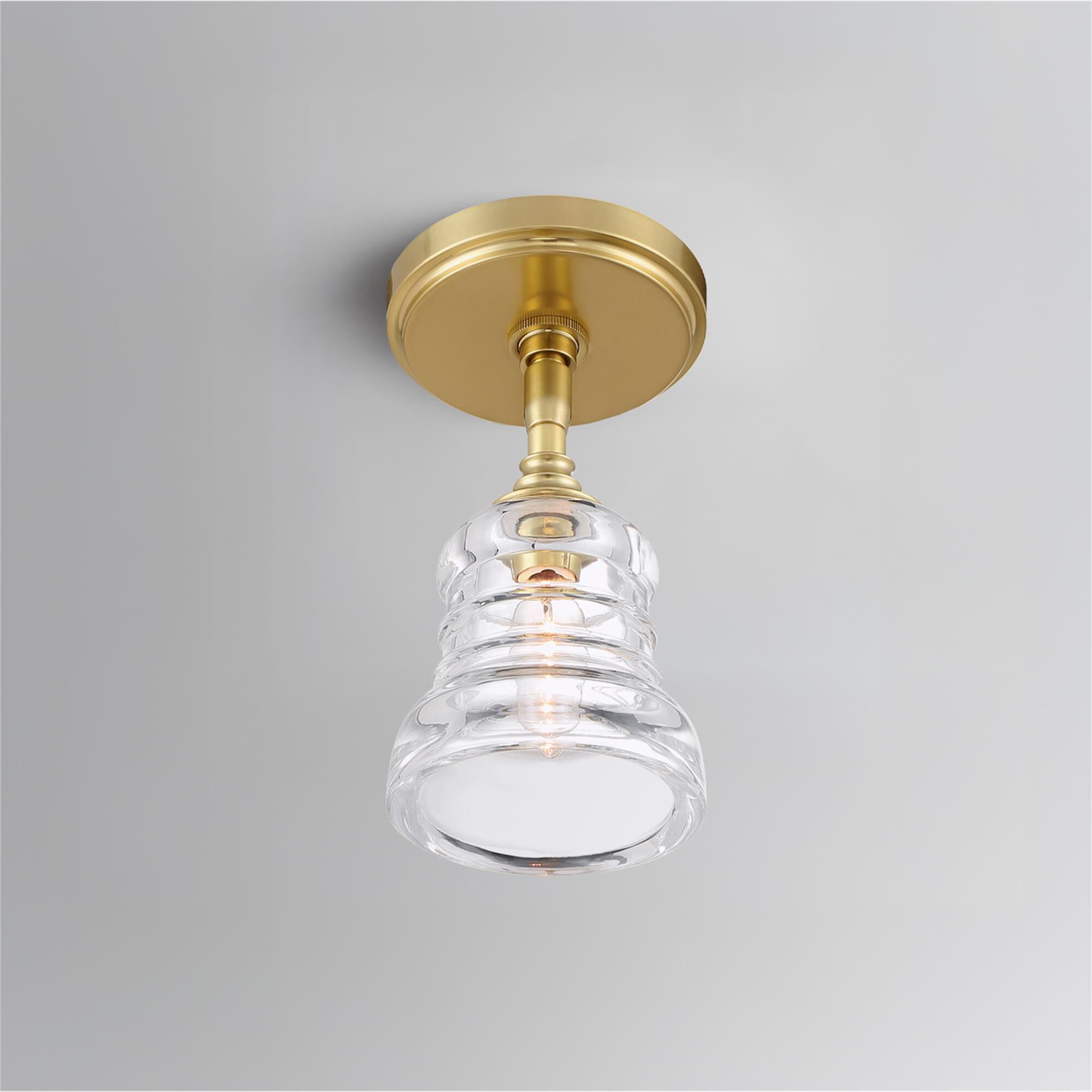 Shown in Aged Brass finish and Clear glass
