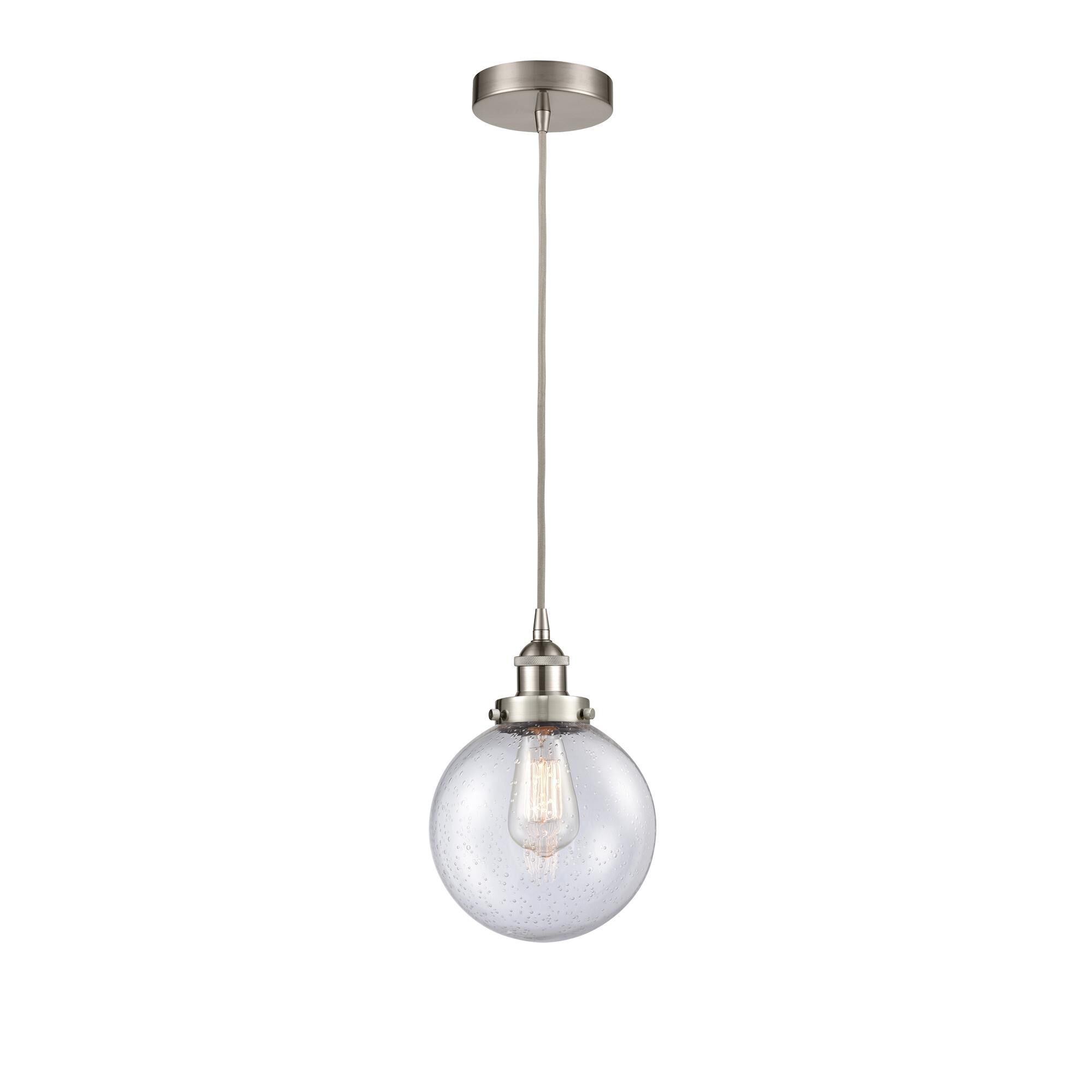 Shown in Brushed Satin Nickel finish and Seedy Beacon glass