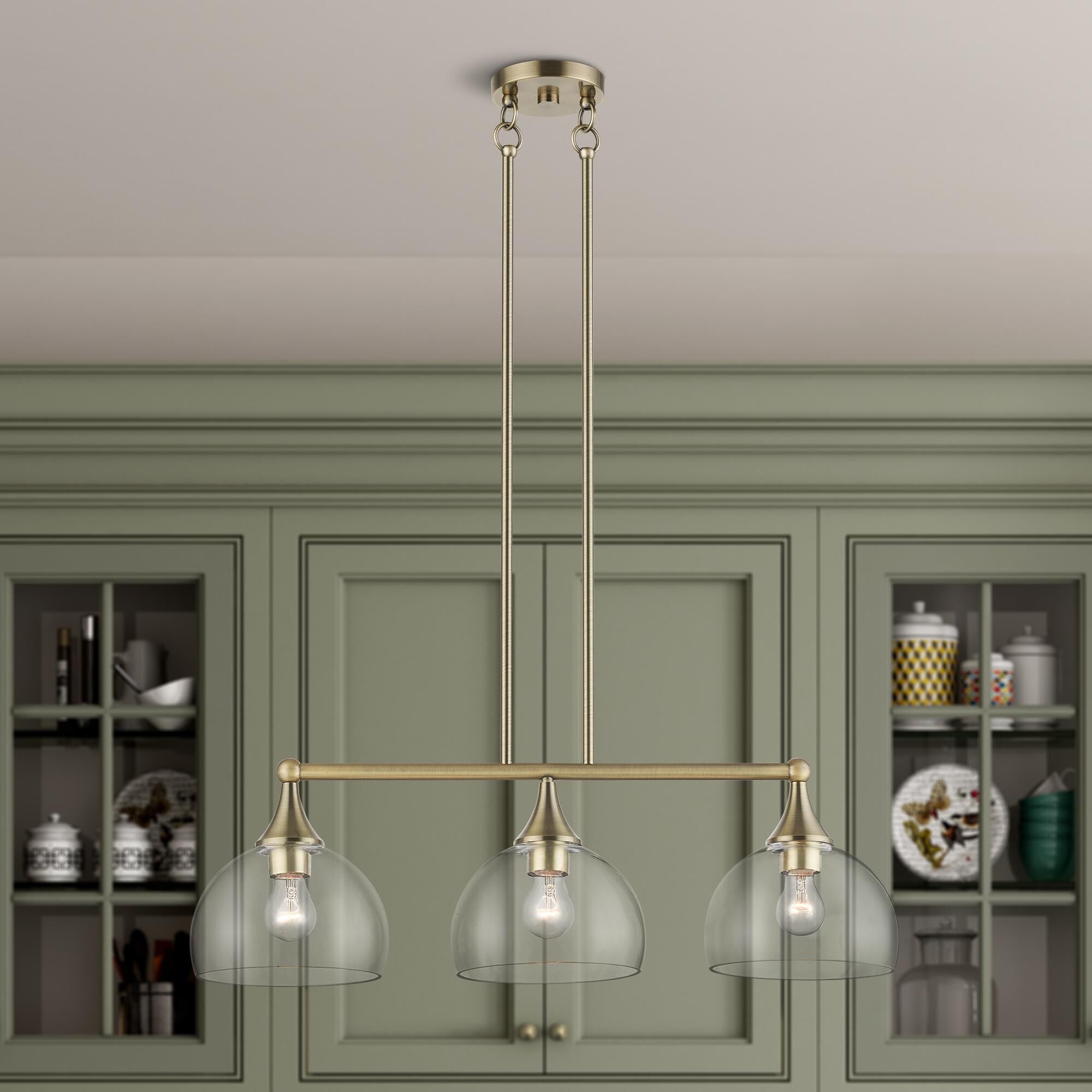 Shown in Antique Brass finish and Clear Hand Blown glass