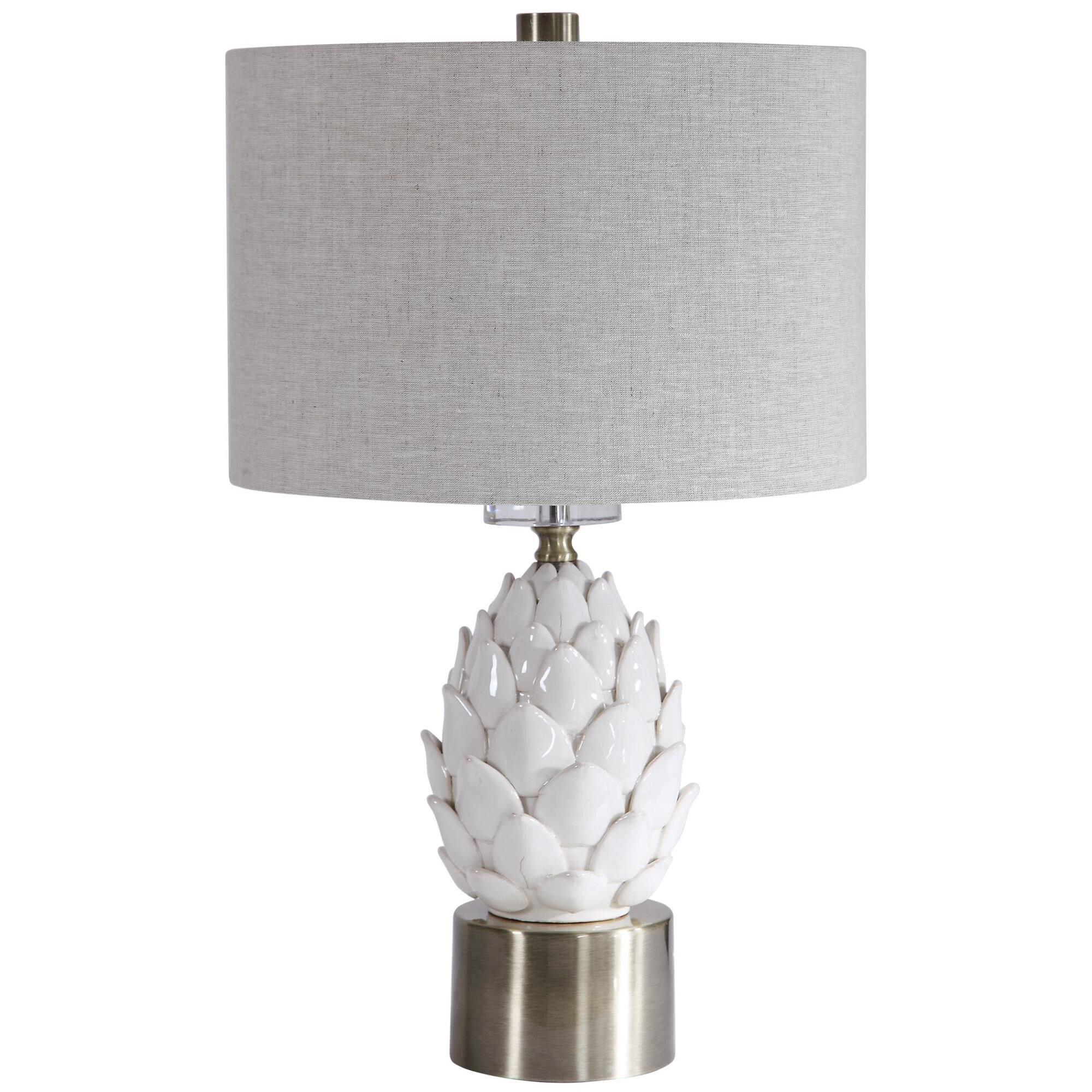 Shown in A White Ceramic Artichoke In A White Crackled Glaze With Aged Brown Tips Accents This Table Lamp. Br finish and Round Drum Hardback shade