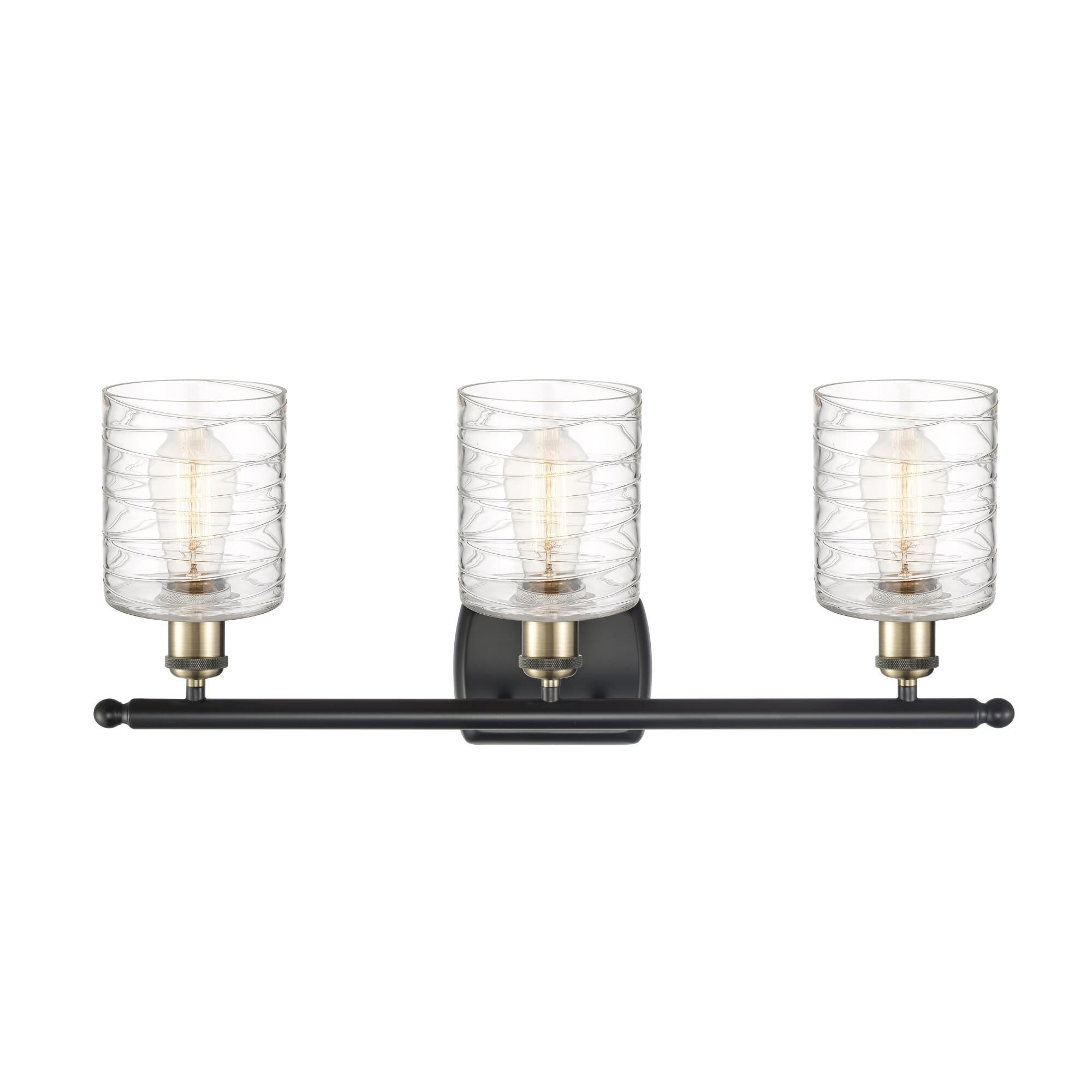 Shown in Black Antique Brass finish and Deco Swirl glass