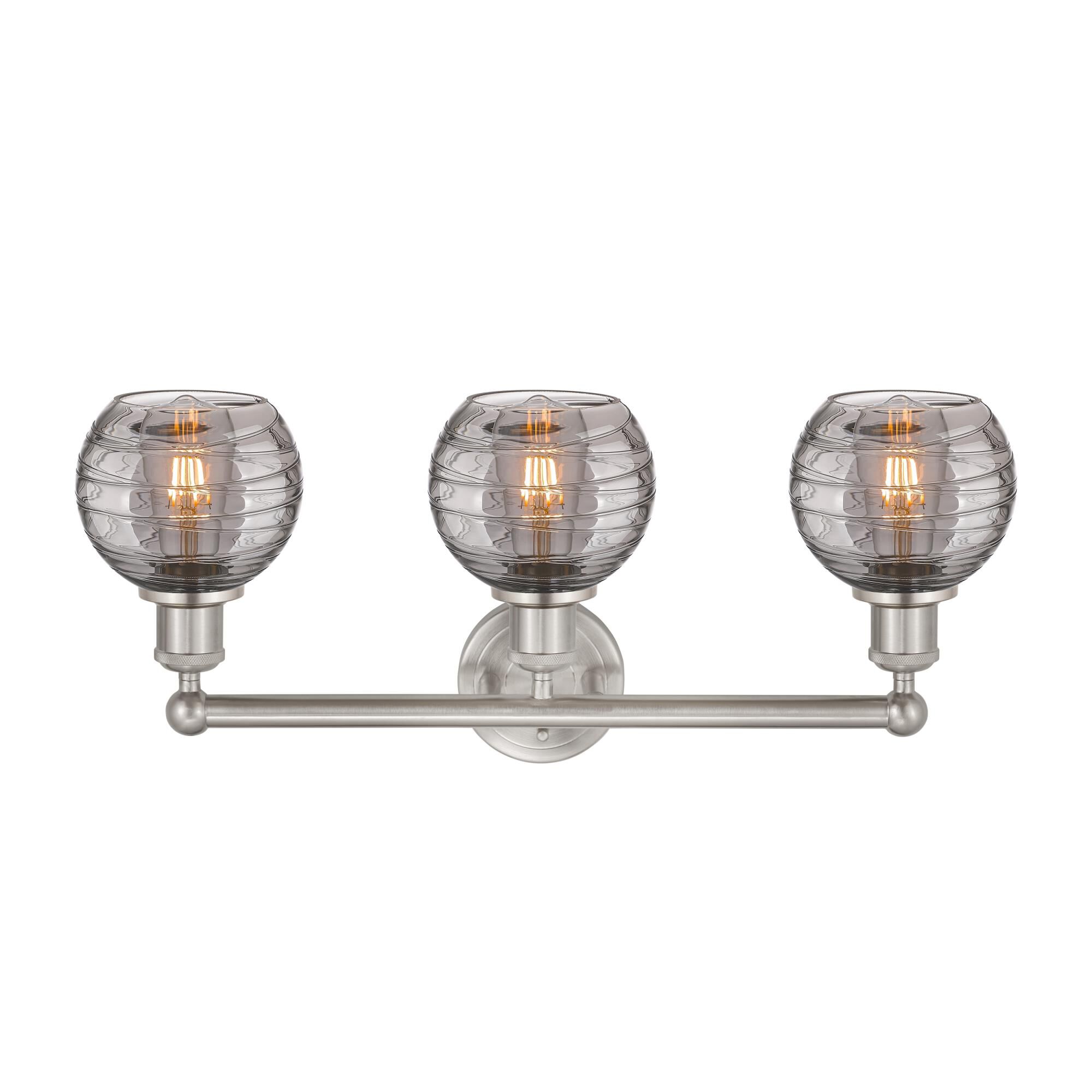 Shown in Brushed Satin Nickel finish and Light Smoke Deco Swirl glass