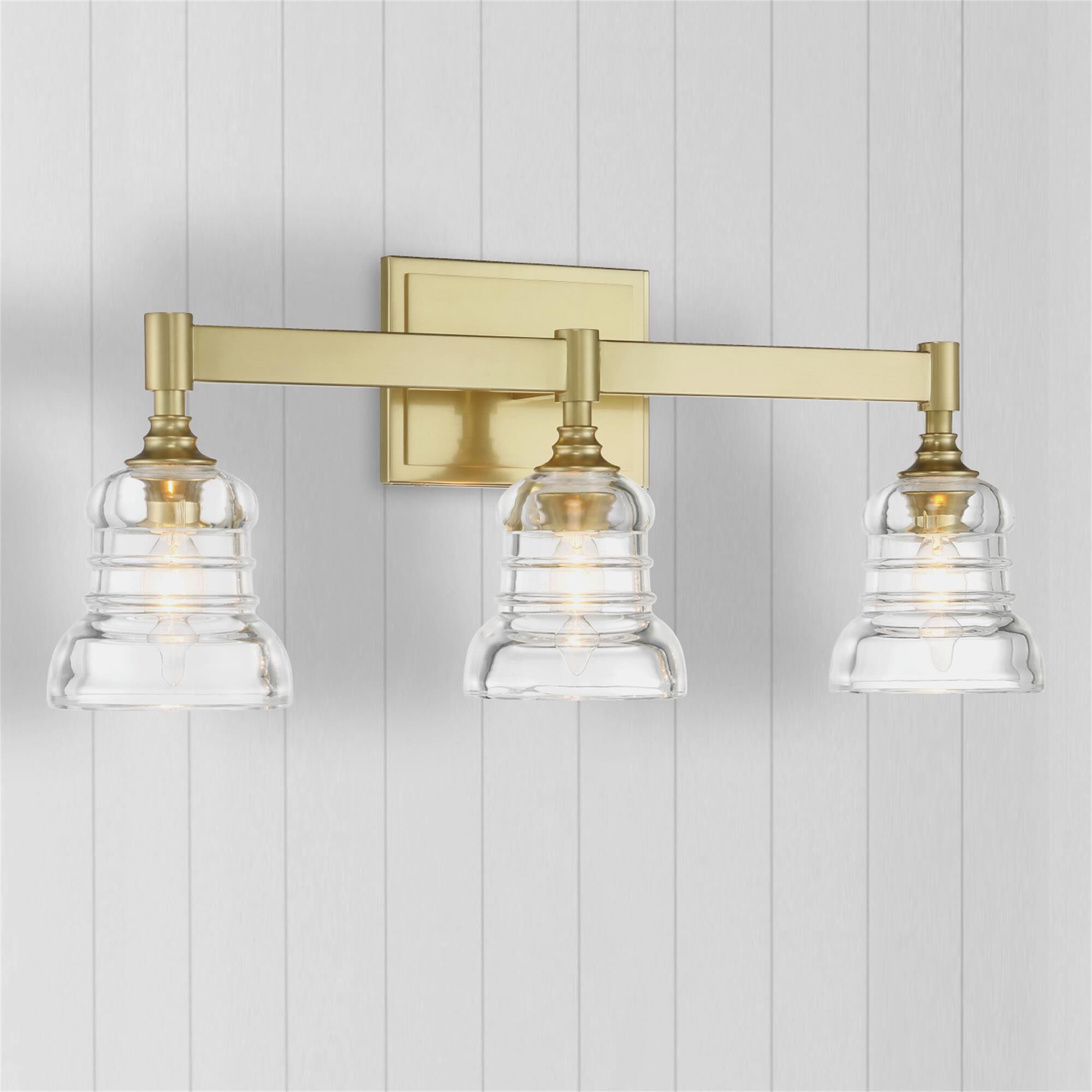 Shown in Aged Brass finish and Clear glass