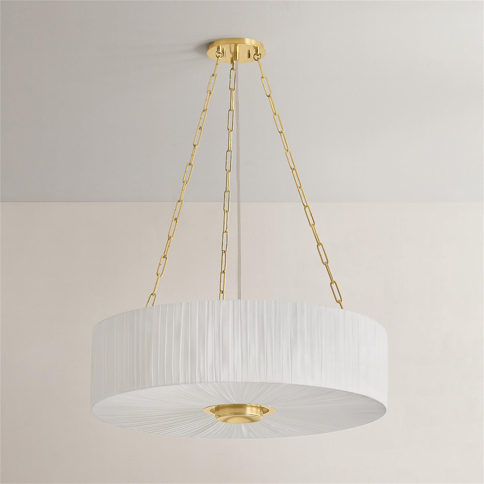 Shown in Aged Brass finish and Ivory Linen shade