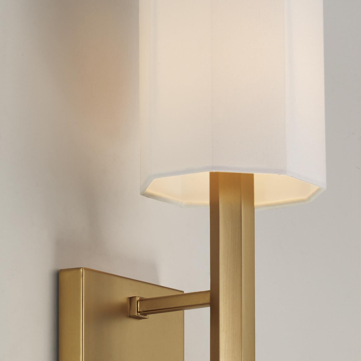 Shown in Aged Brass finish and White Fabric Octagonal shade