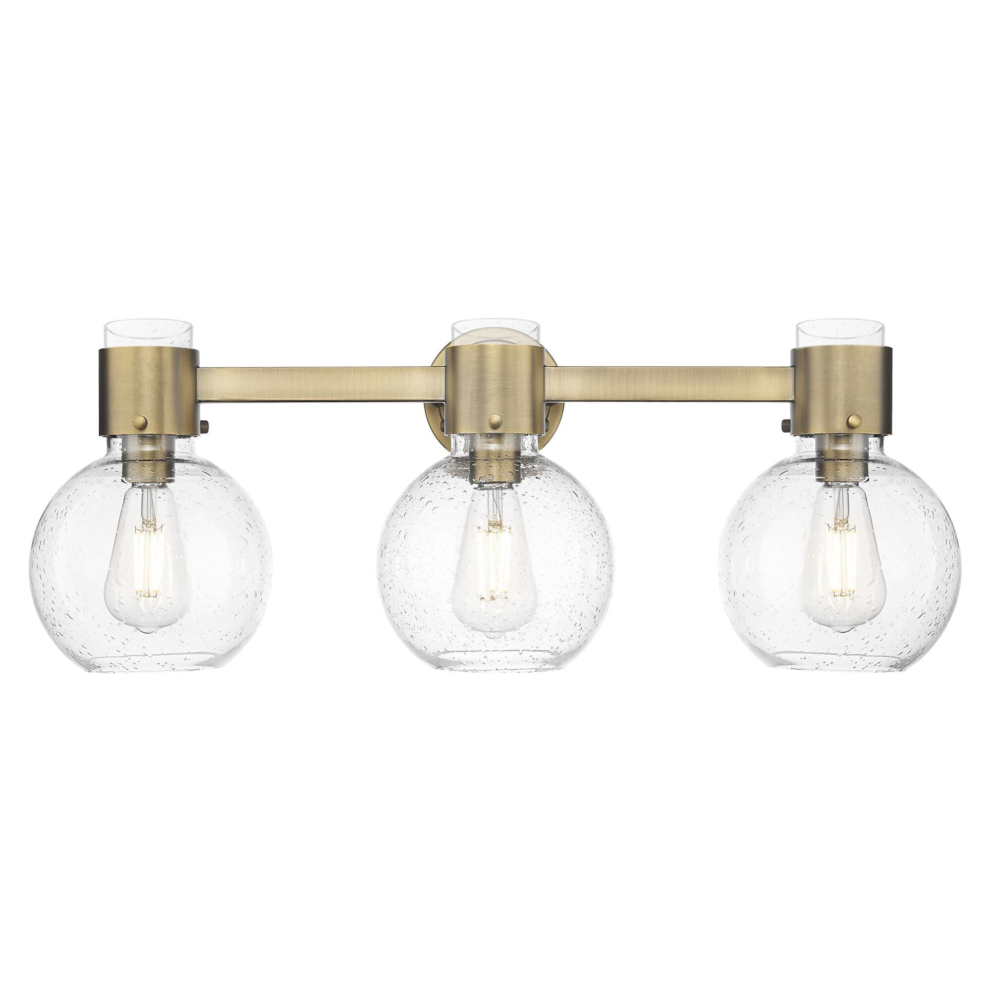 Shown in Brushed Brass finish and Seedy glass