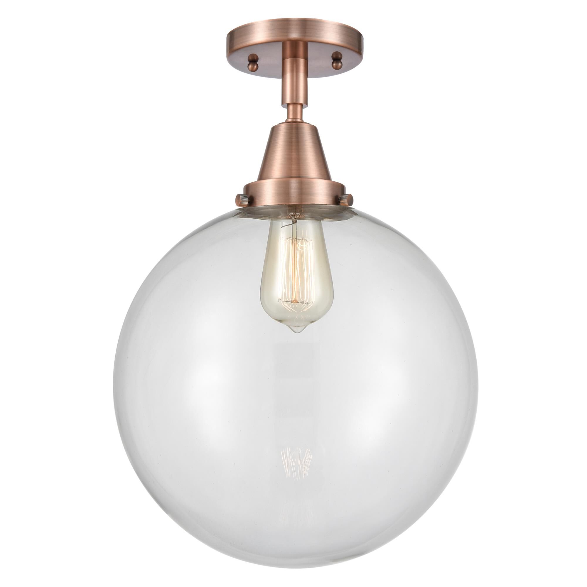 Shown in Antique Copper finish and Clear Beacon glass