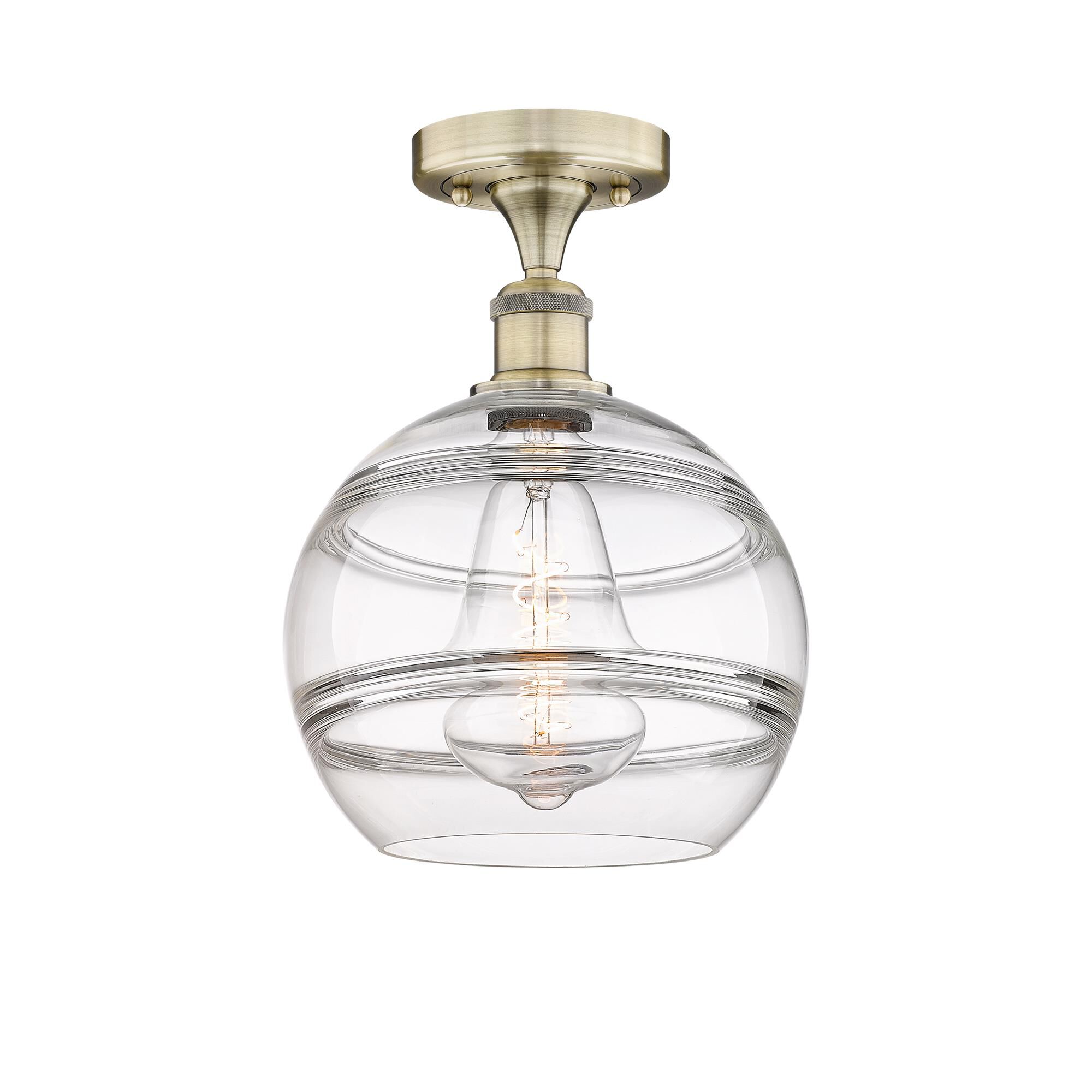 Shown in Antique Brass finish and Clear glass