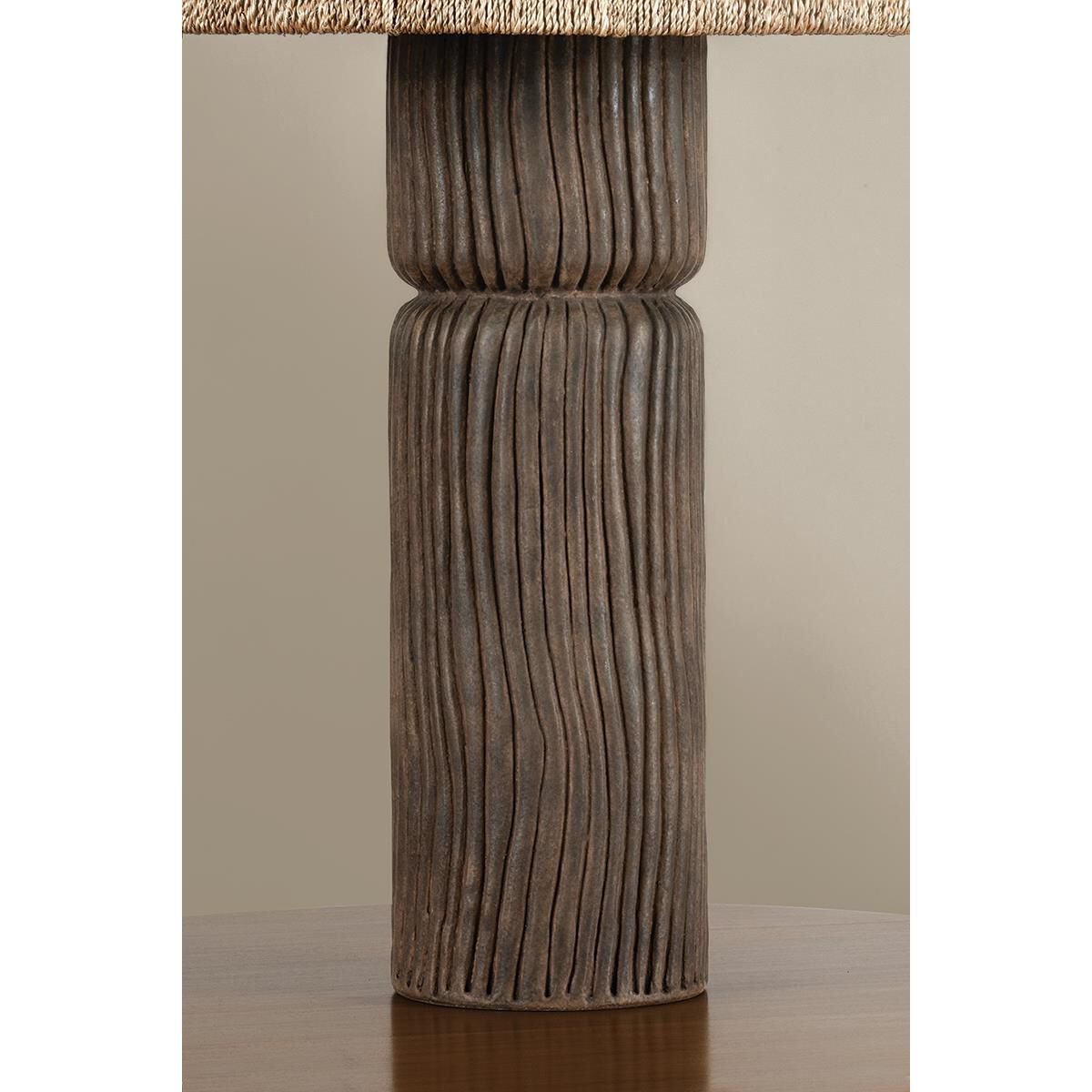 Shown in Patina Brass and Ceramic Shadowed Bark finish and Abaca shade