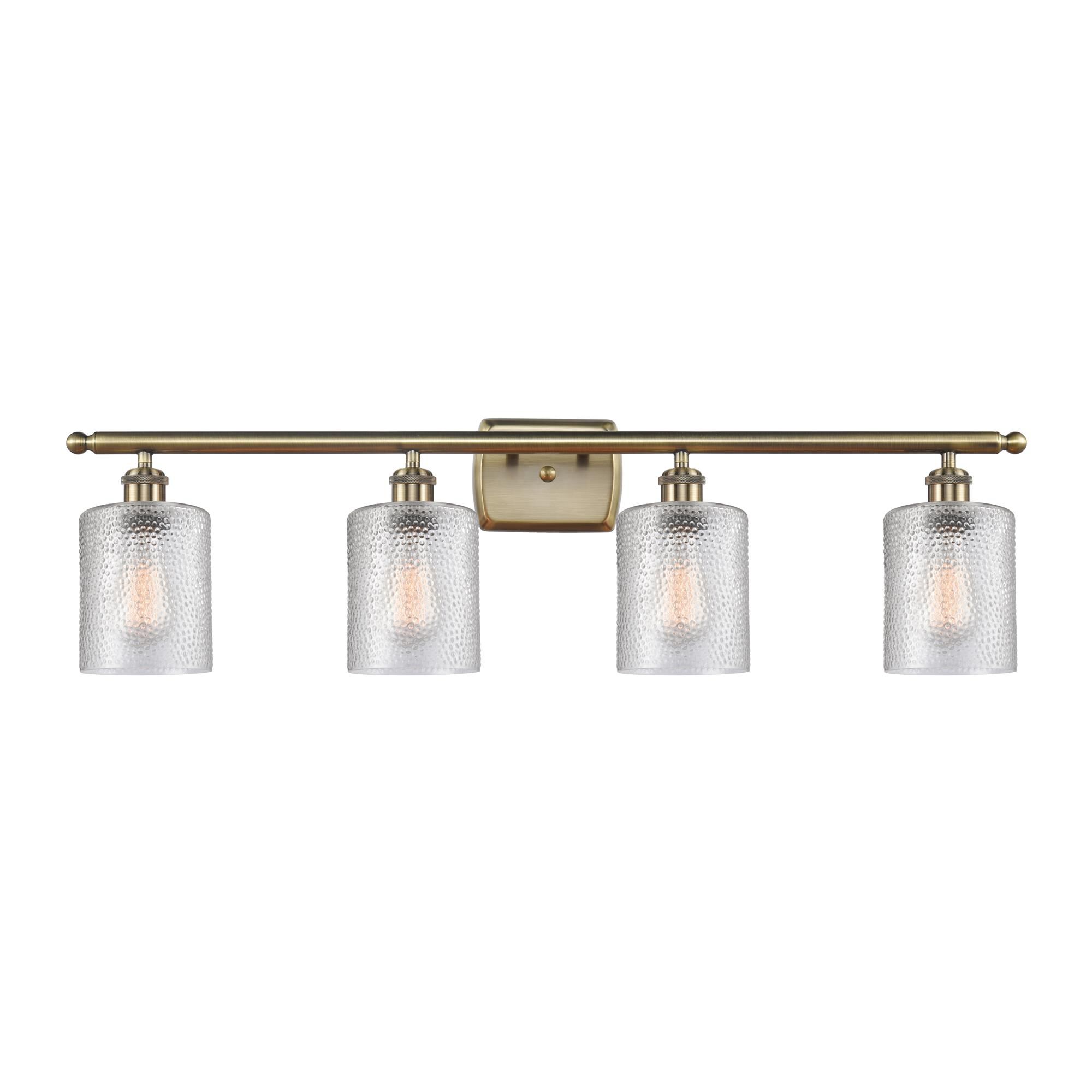 Shown in Antique Brass finish and Clear Cobbleskill glass and None shade