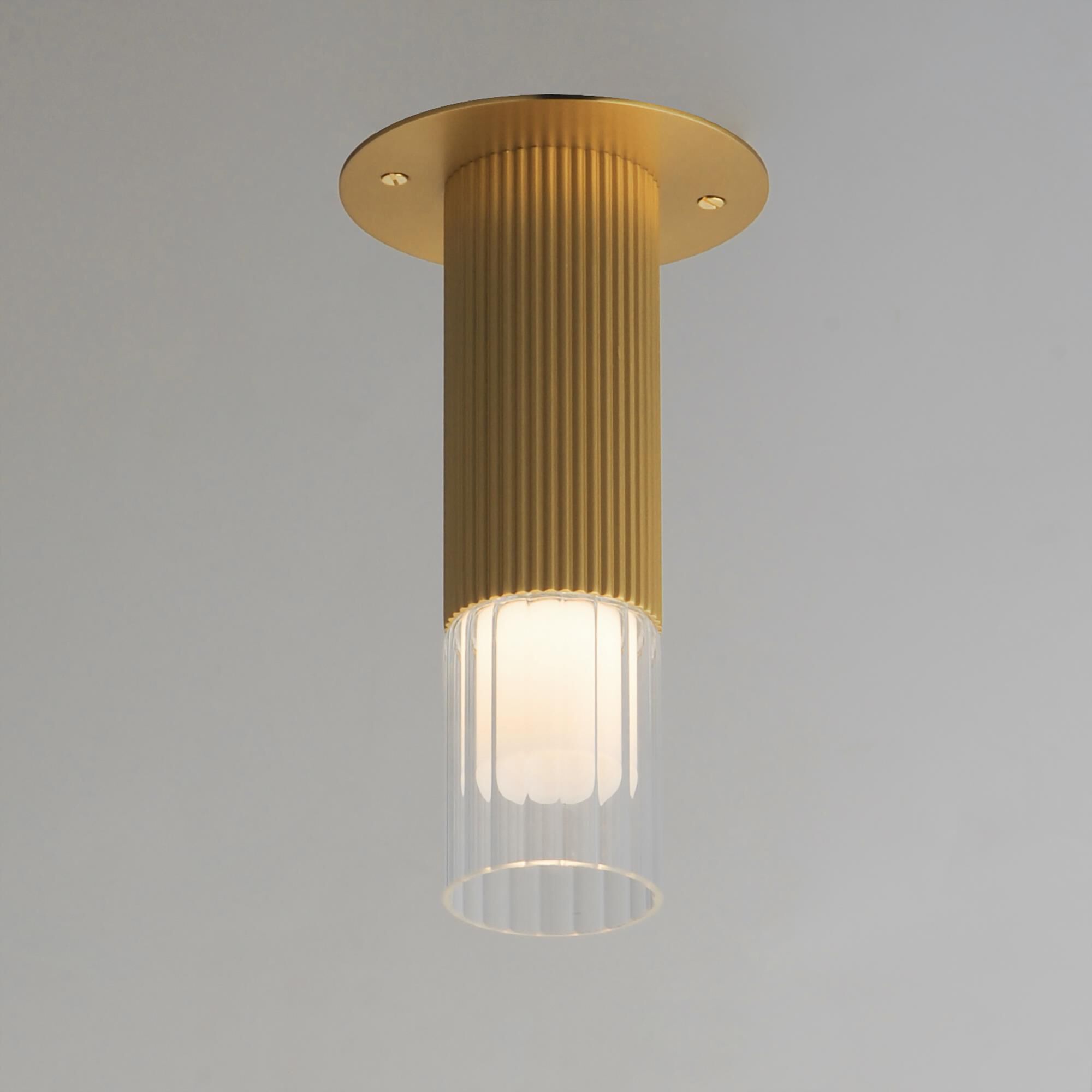Shown in Gold finish and Clear Ribbed glass