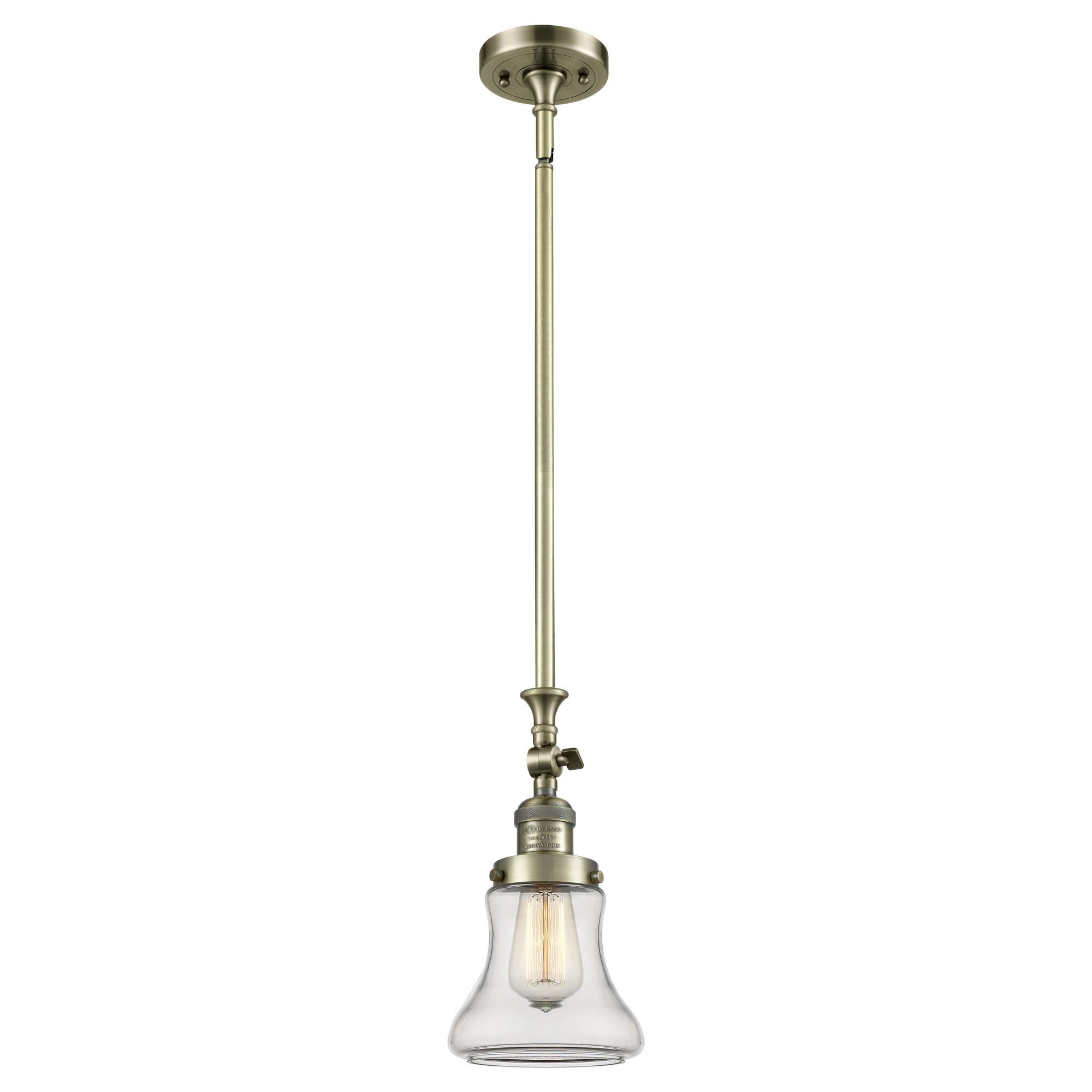 Shown in Antique Brass finish and Clear glass