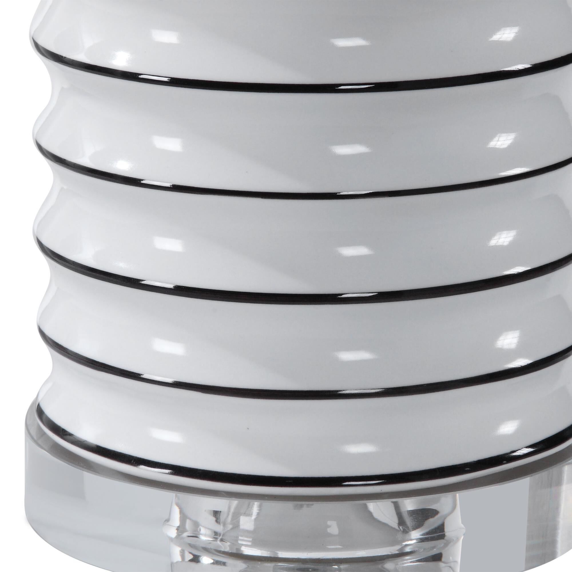 Shown in This Ceramic Lamp Features A Gloss White Ribbed Base Tipped With Bold Black Stripes, Accented With B finish and Round Drum Hardback shade