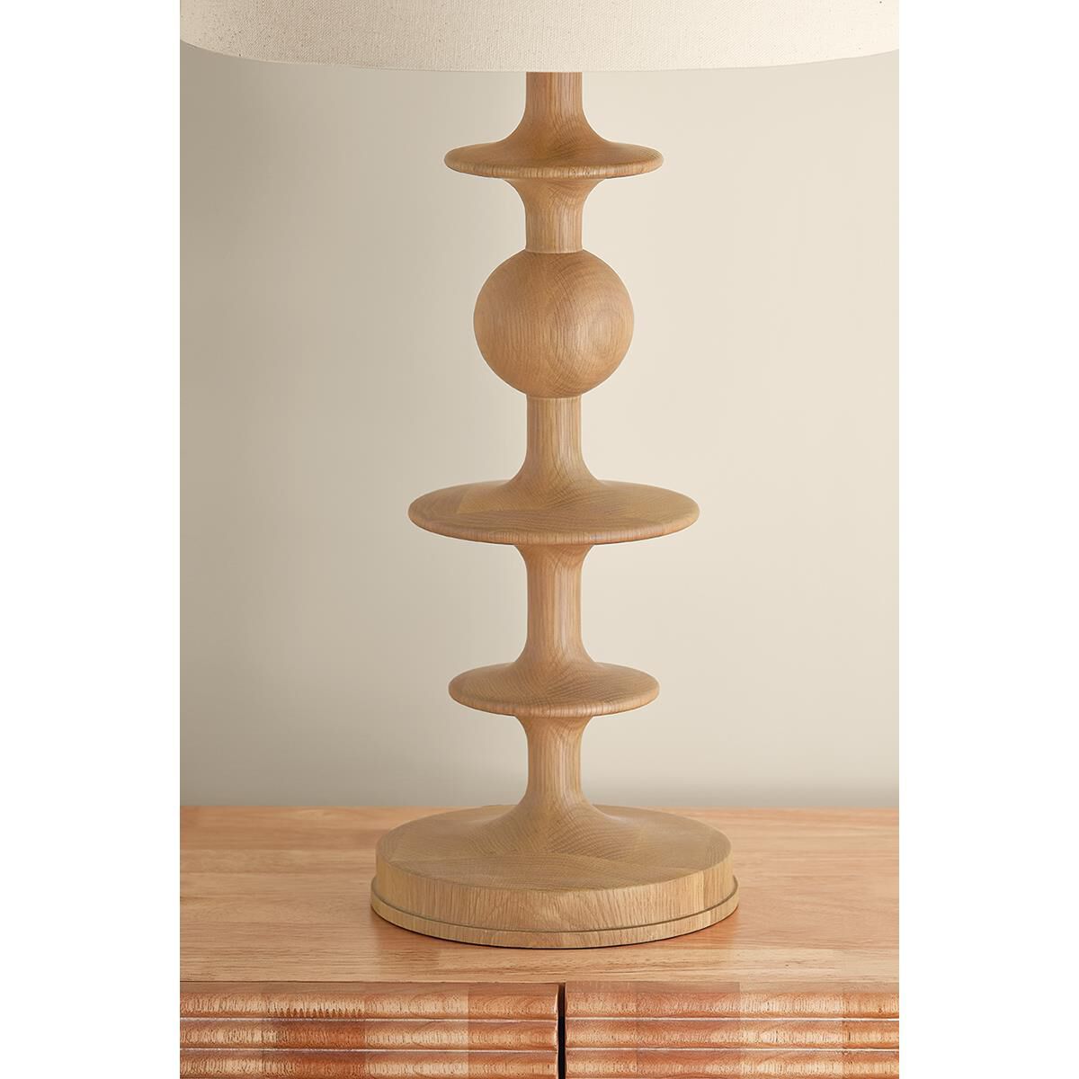 Shown in Aged Brass finish and Wheat Linen shade