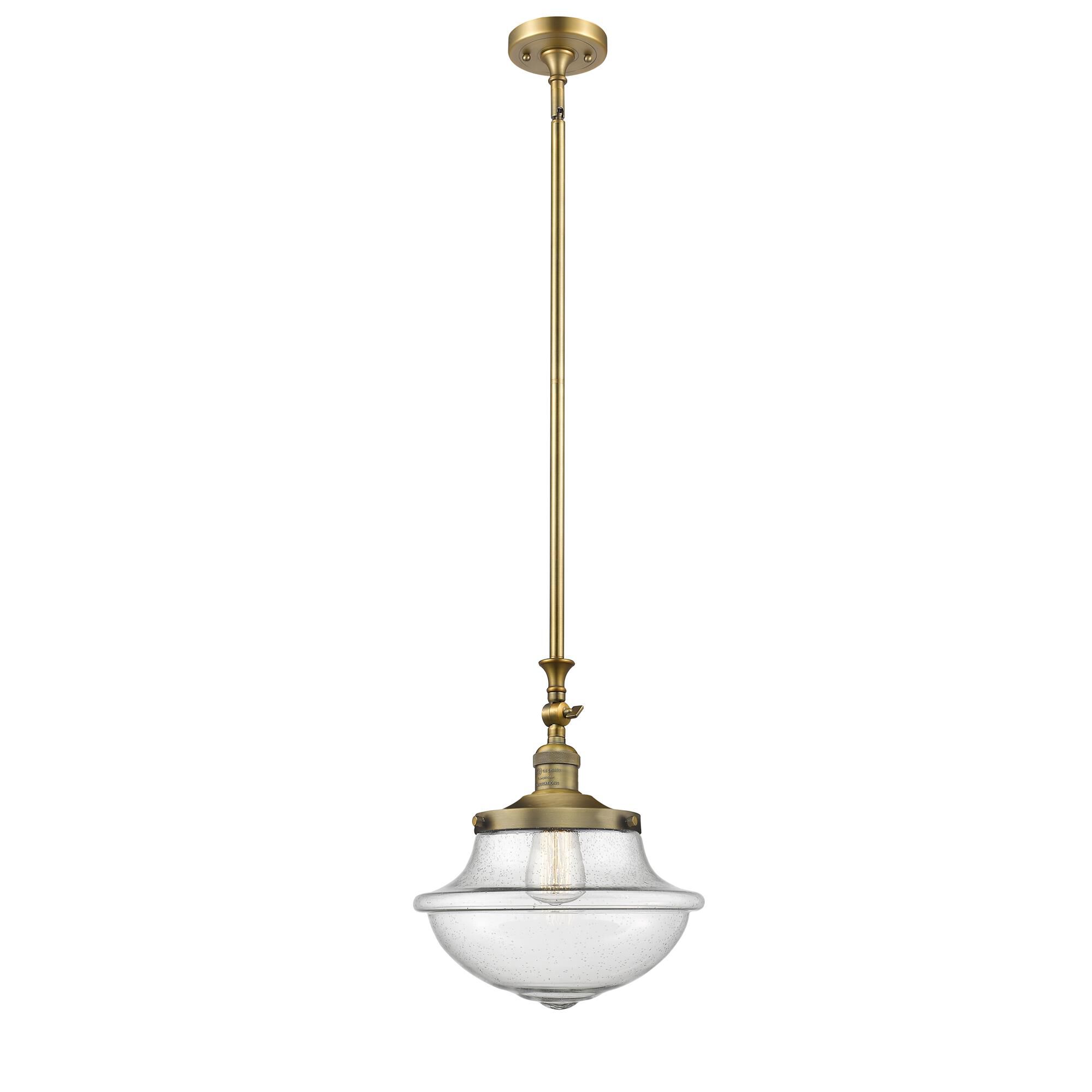 Shown in Brushed Brass finish and Seedy glass