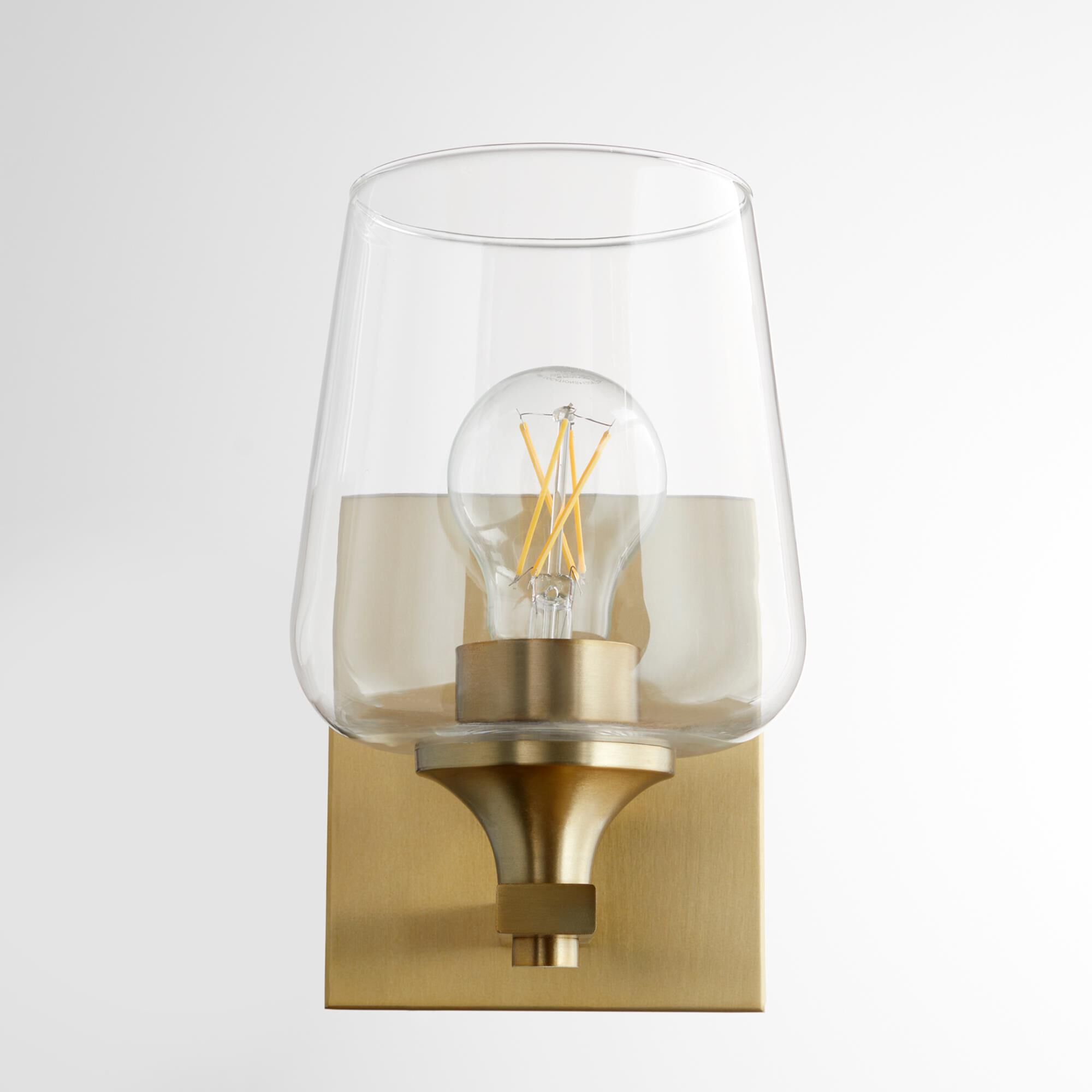 Shown in Aged Brass finish and Clear glass