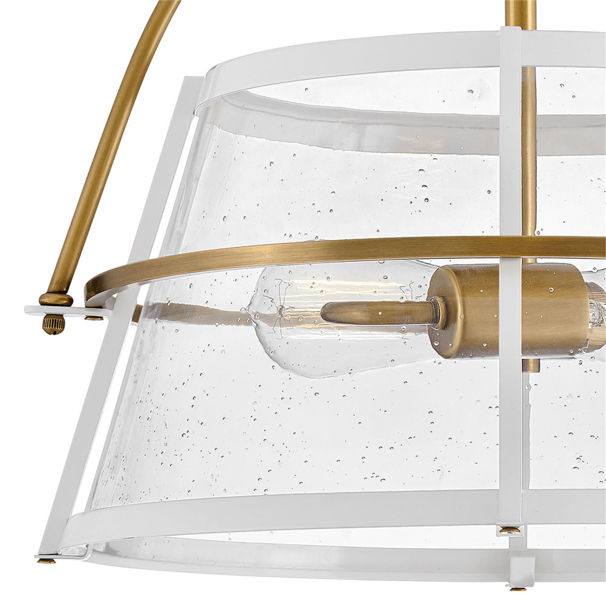 Shown in Heritage Brass with Polished White Accents finish and Clear Seedy glass