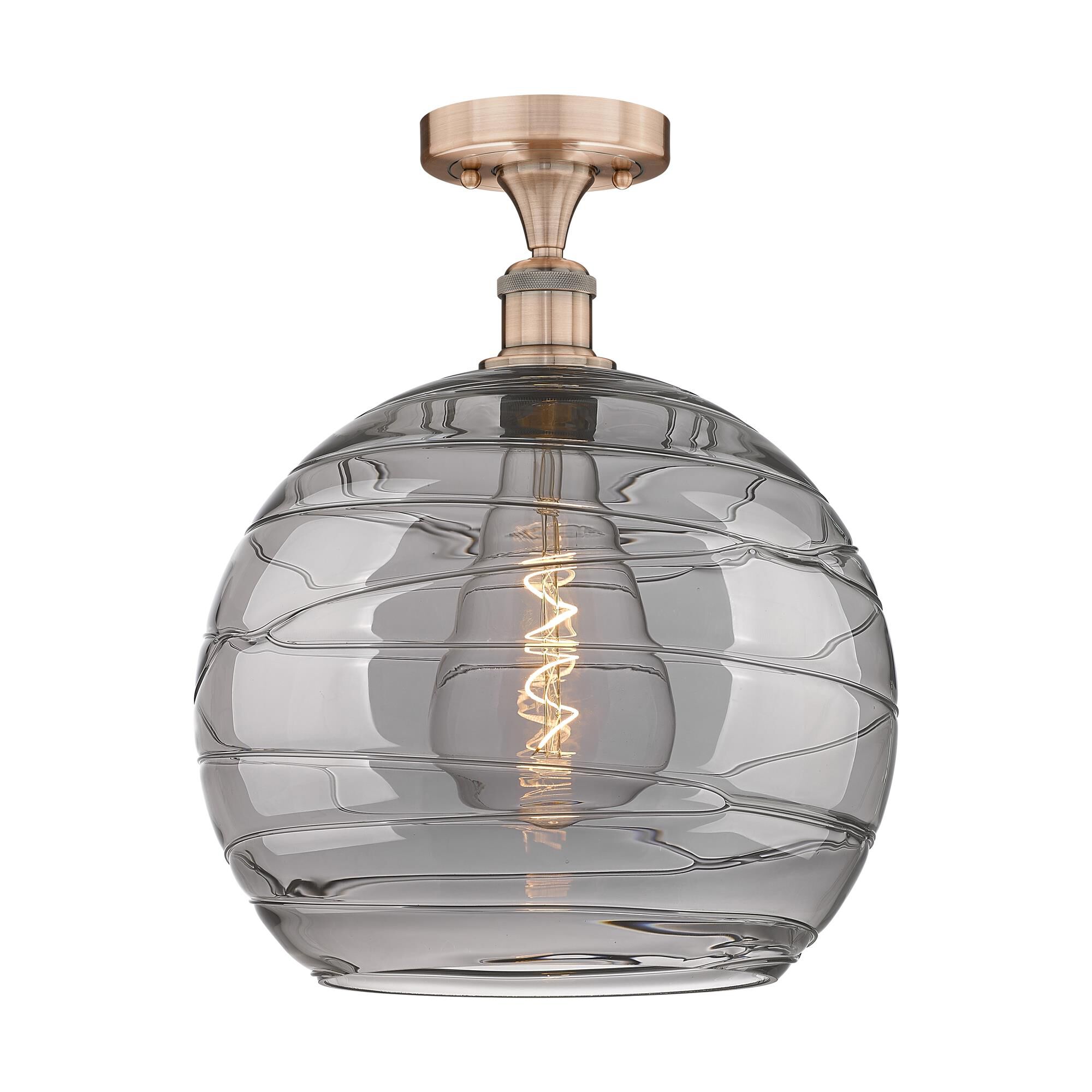 Shown in Antique Copper finish and Light Smoke Deco Swirl glass