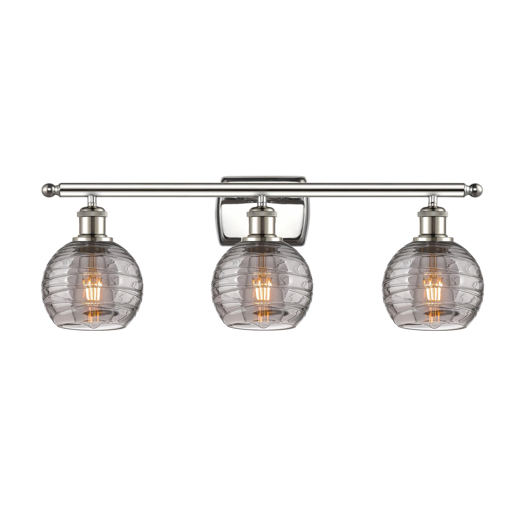 Shown in Polished Nickel finish and Light Smoke Deco Swirl glass
