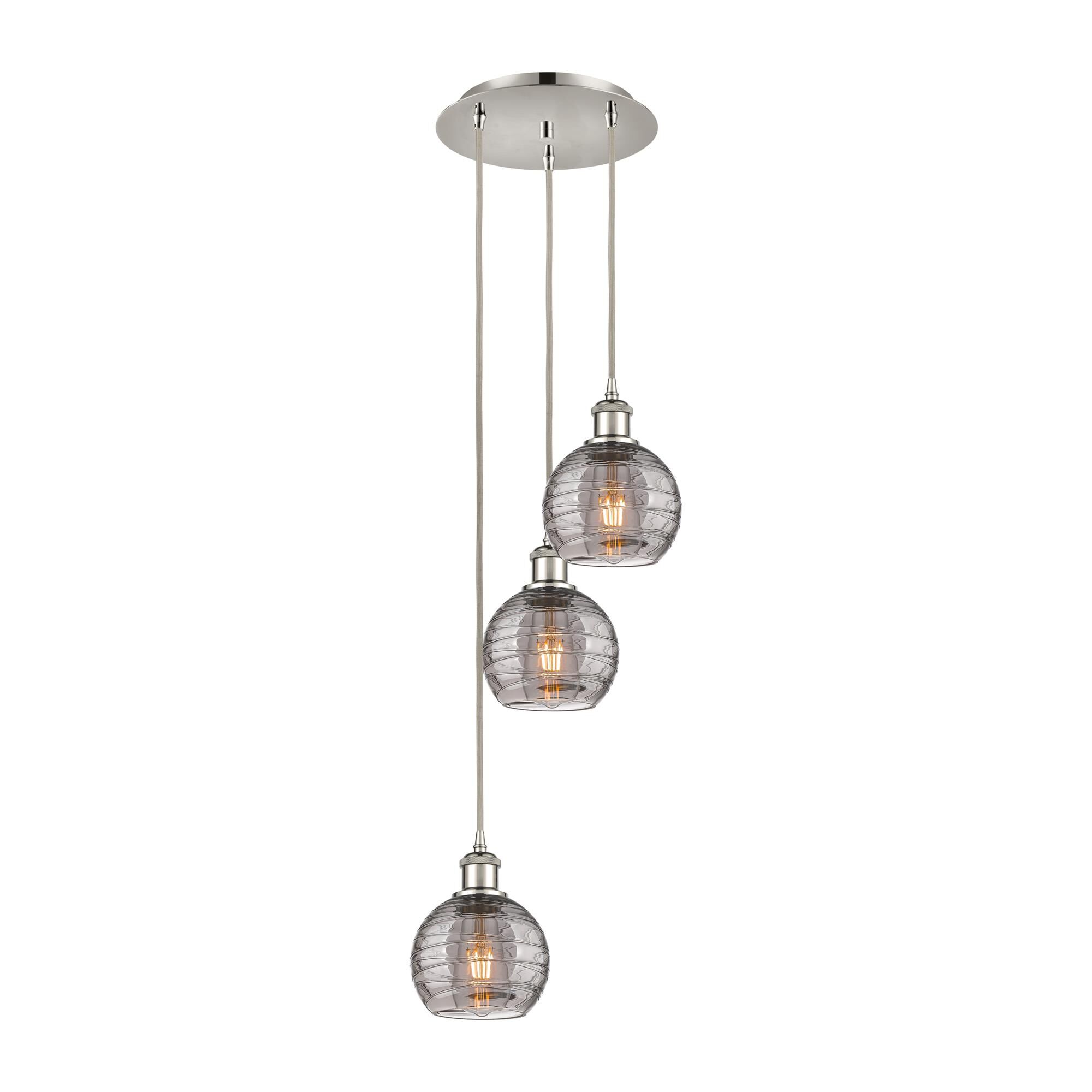Shown in Polished Nickel finish and Light Smoke Deco Swirl glass