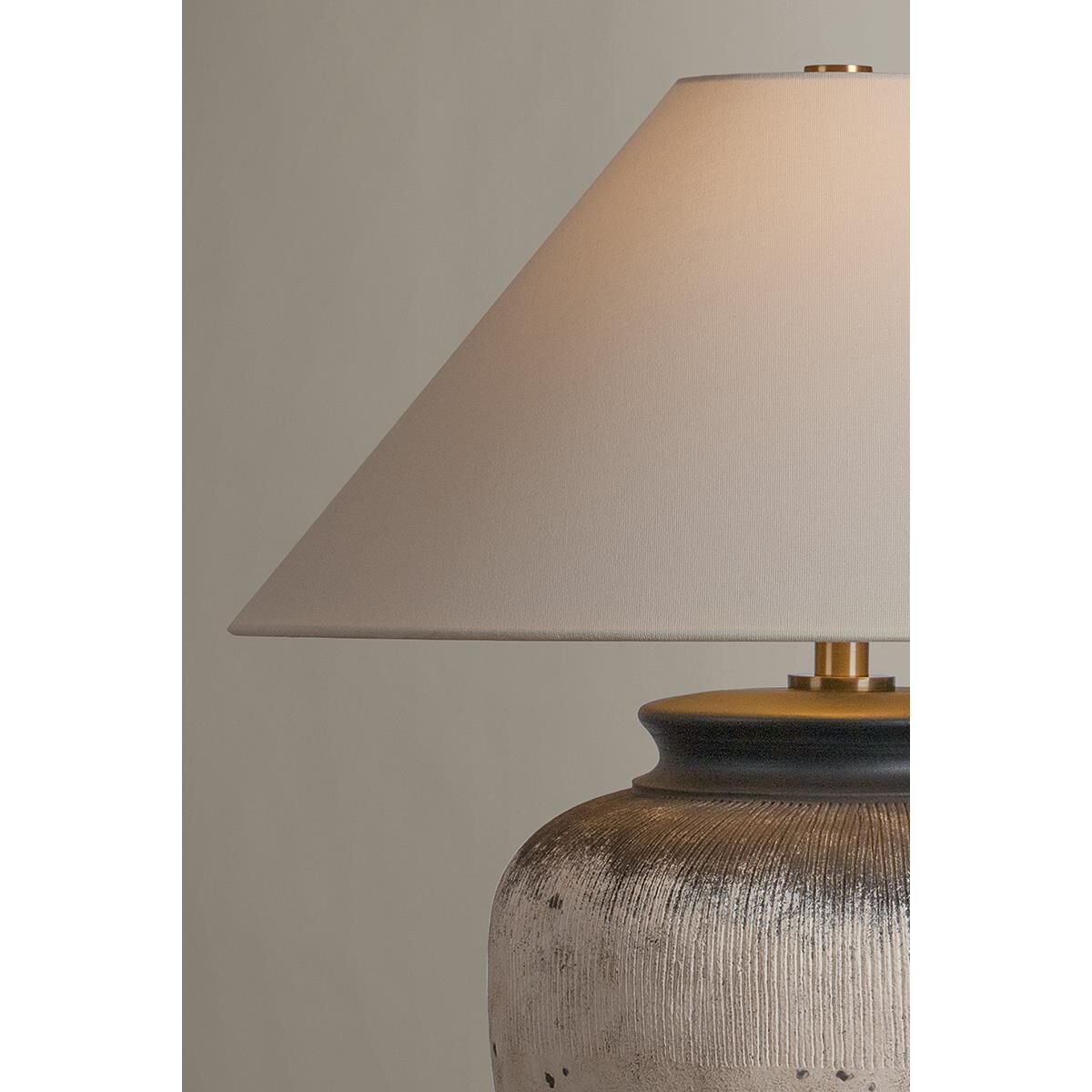 Shown in Patina Brass and Ceramic Flamed White finish and Off White Linen shade