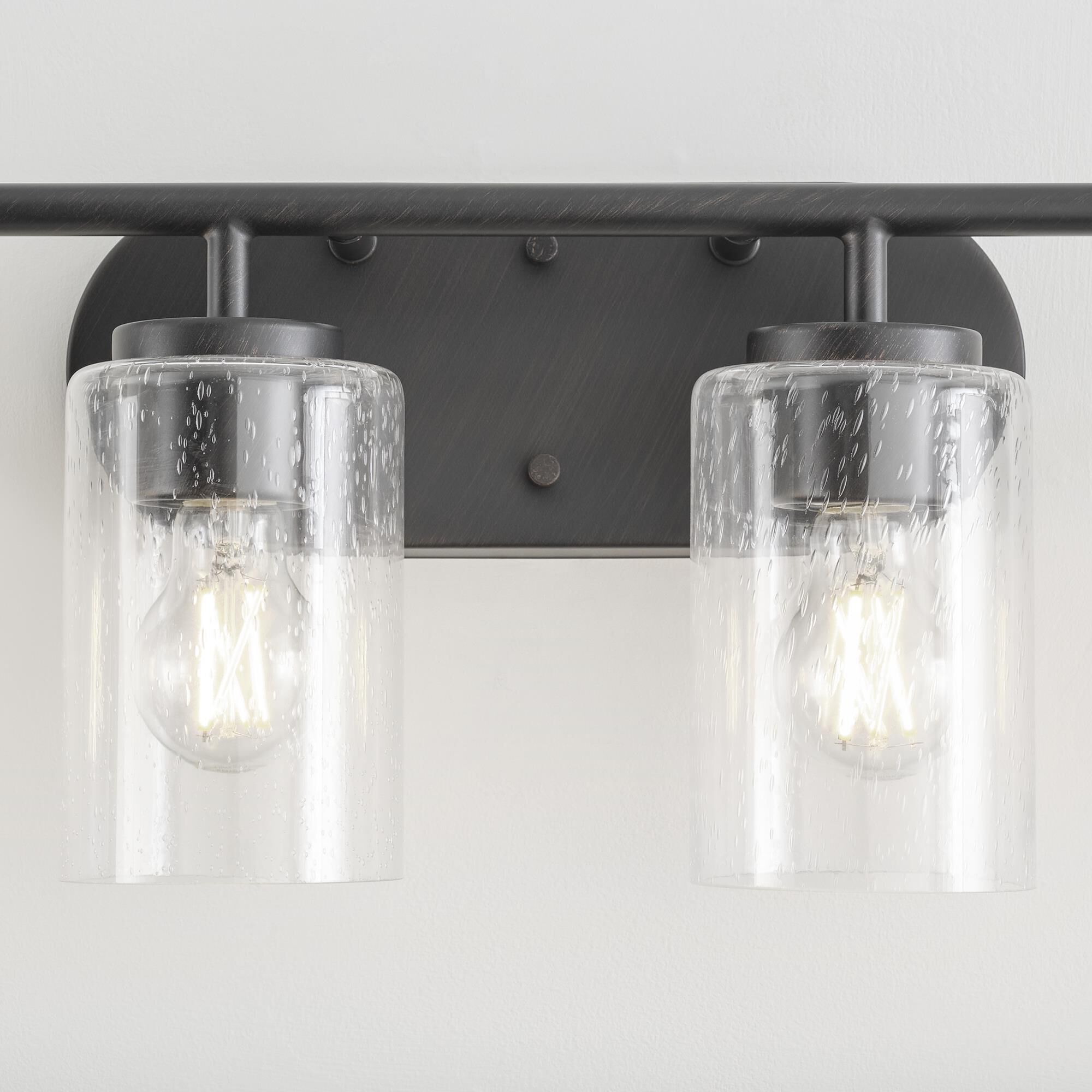 Shown in Bronze finish and Clear Seeded glass