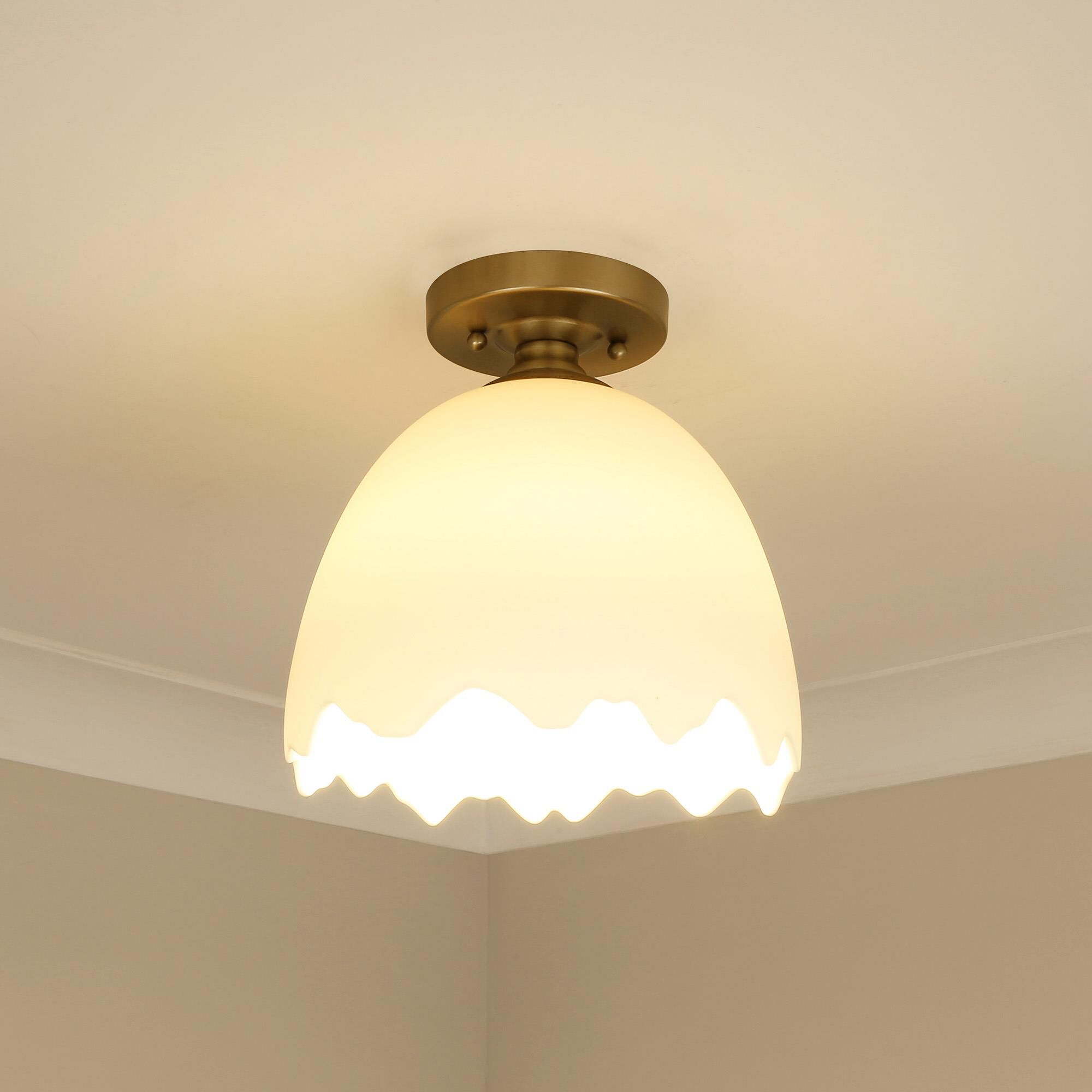 Shown in Brushed Champagne Bronze finish and Porcelain Shade glass