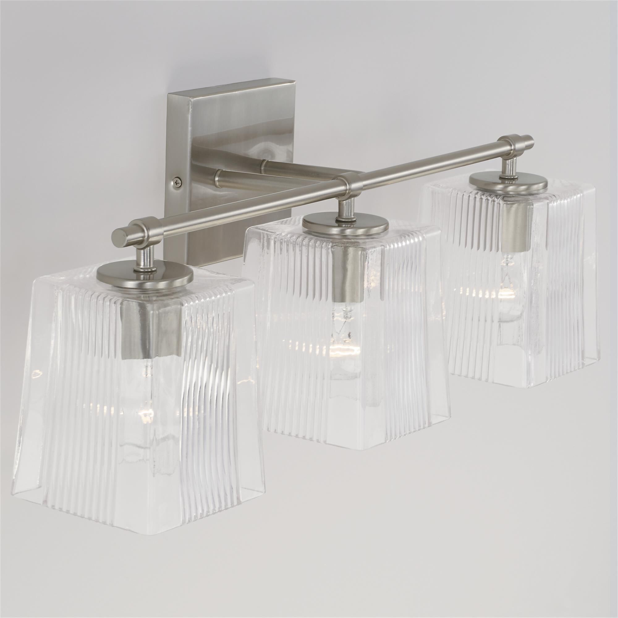 Shown in Brushed Nickel finish and Clear Fluted glass