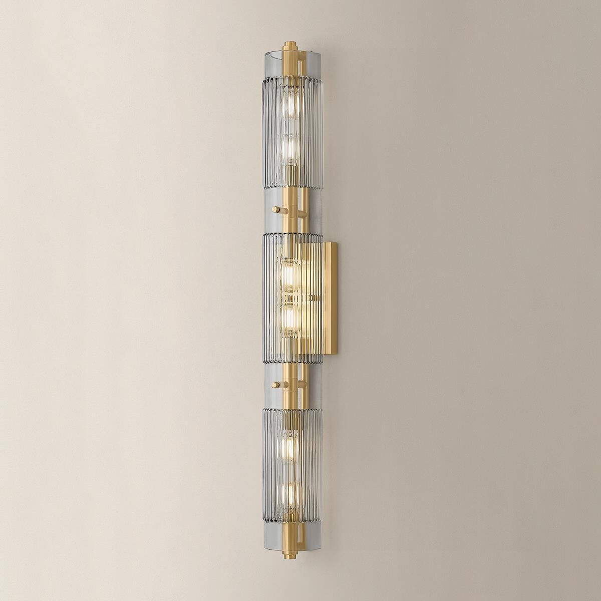 Shown in Vintage Brass finish and Clear Smoke glass