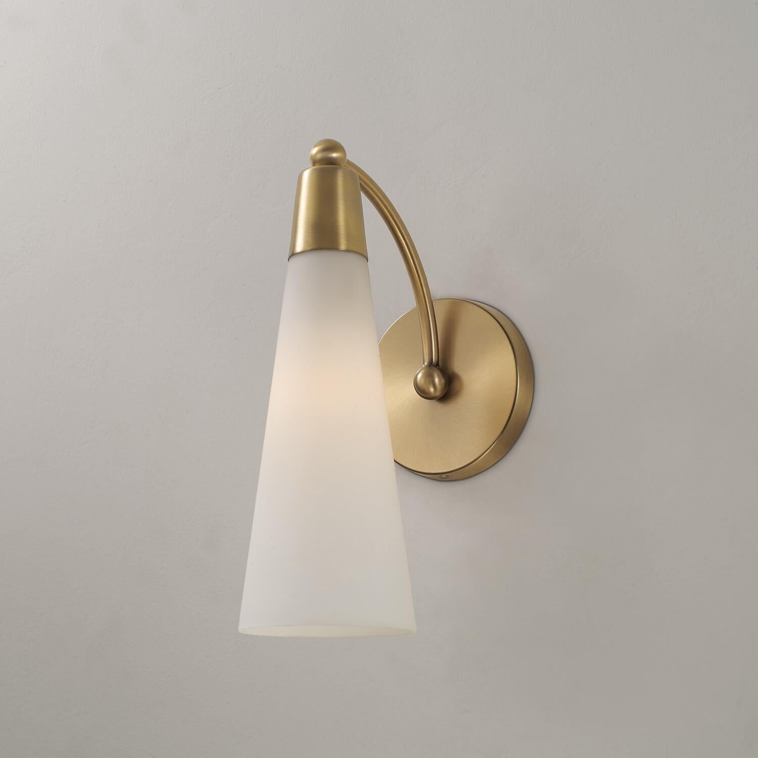 Shown in Aged Brass finish and Soft White glass