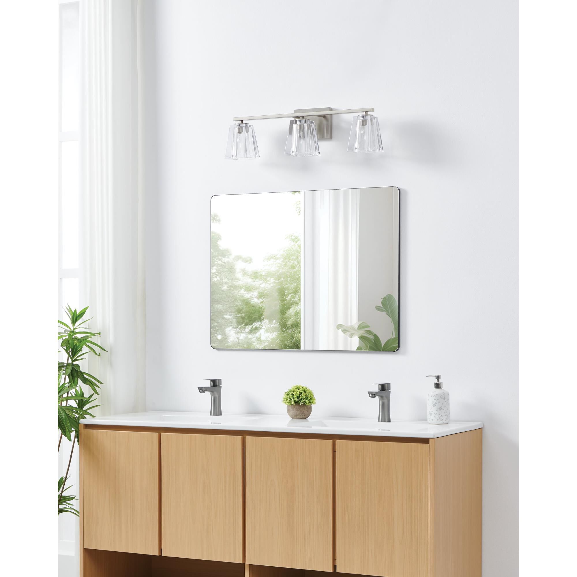 Shown in Brushed Nickel finish and Clear Pressed glass