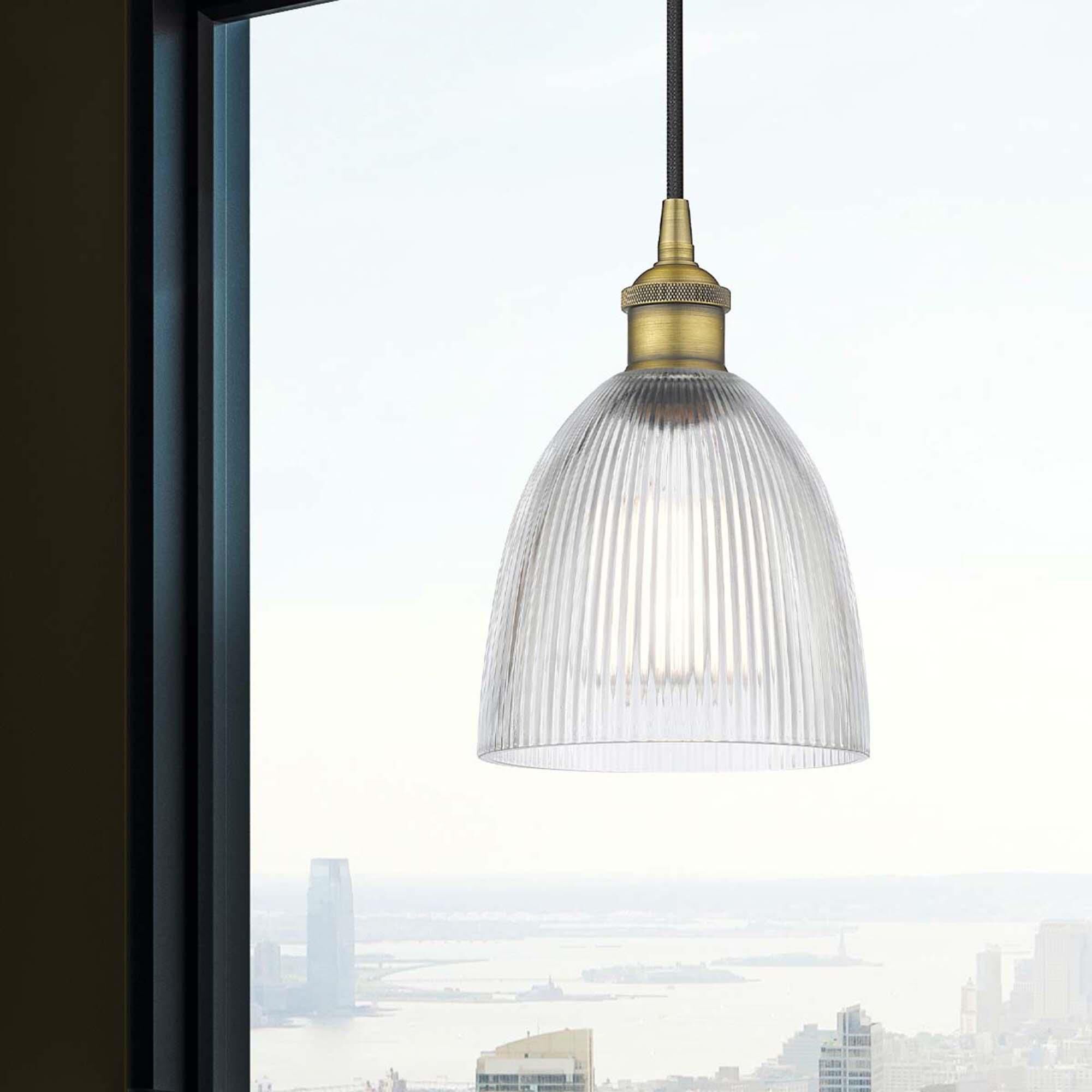 Shown in Brushed Brass finish and Clear Castile glass