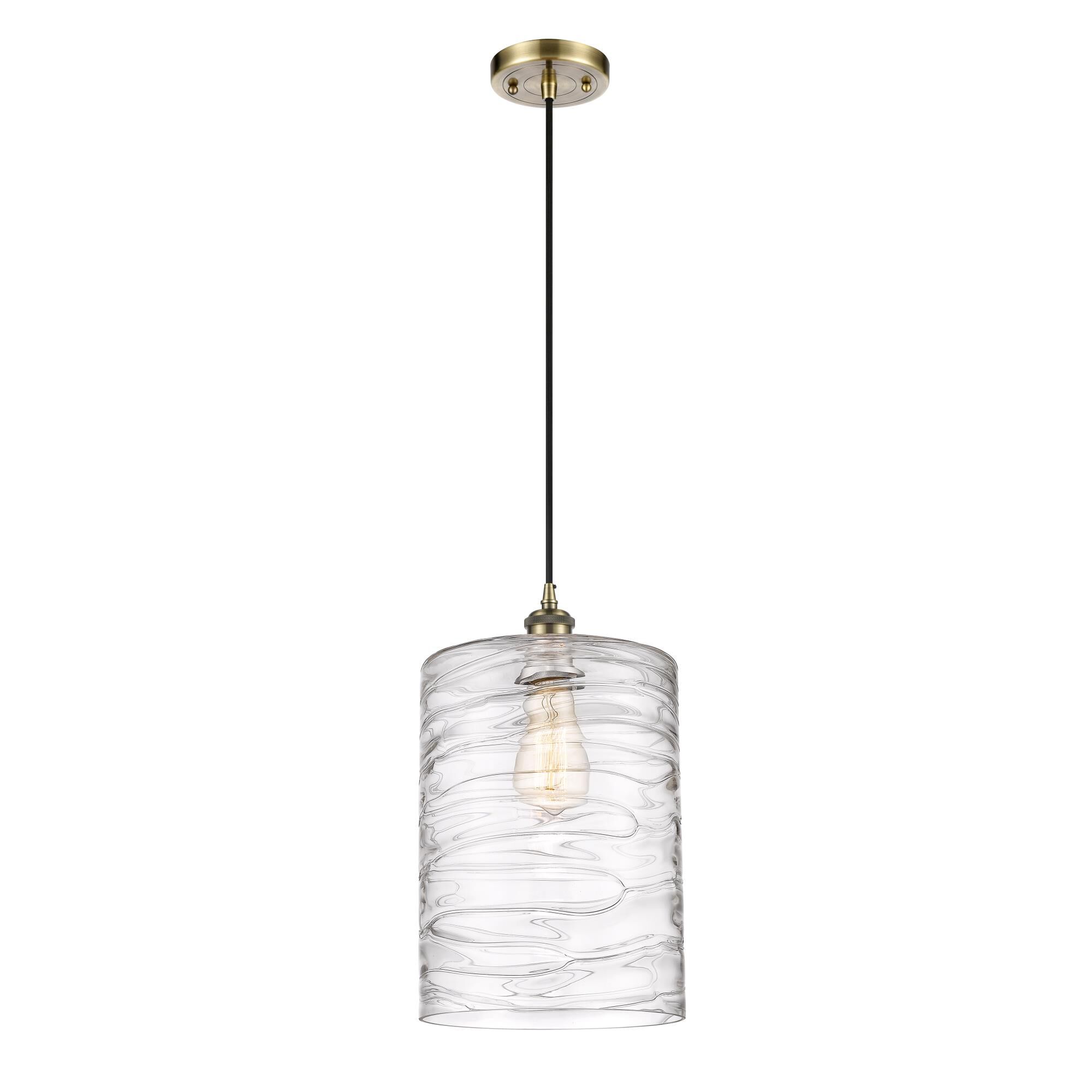 Shown in Antique Brass finish and Deco Swirl Large Cobbleskill glass