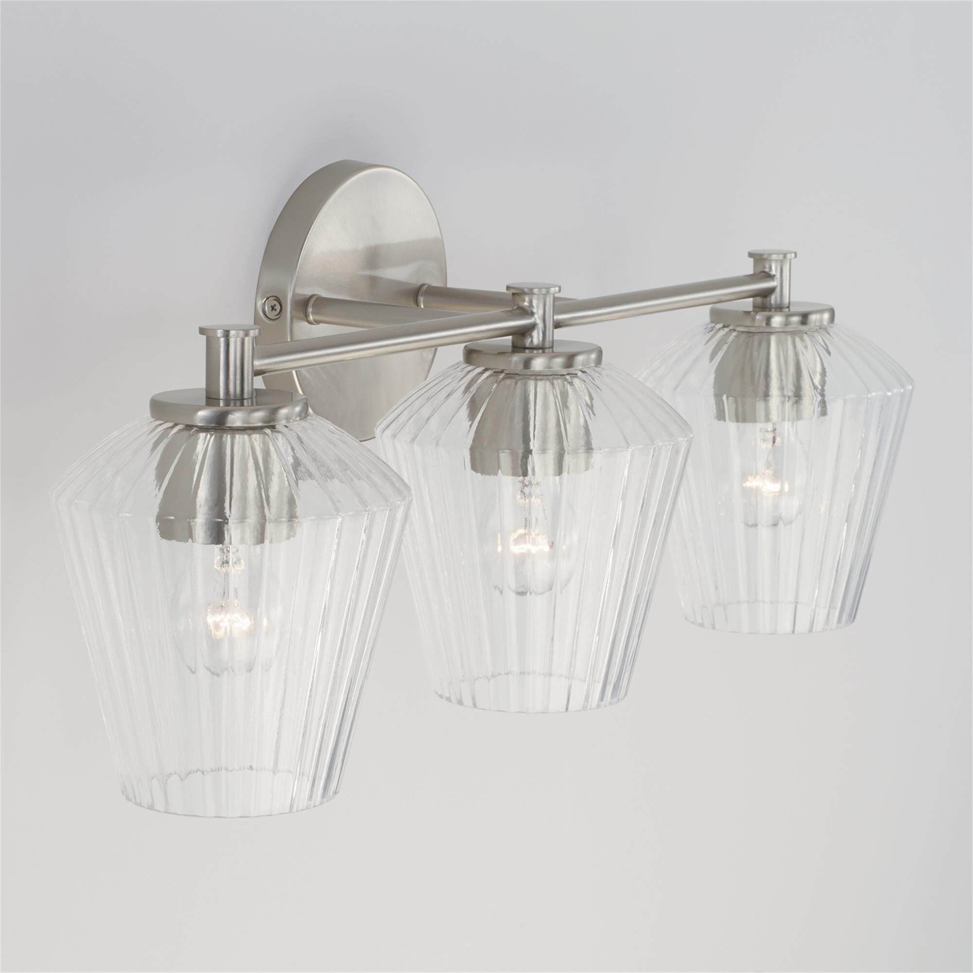 Shown in Brushed Nickel finish and Clear Fluted glass