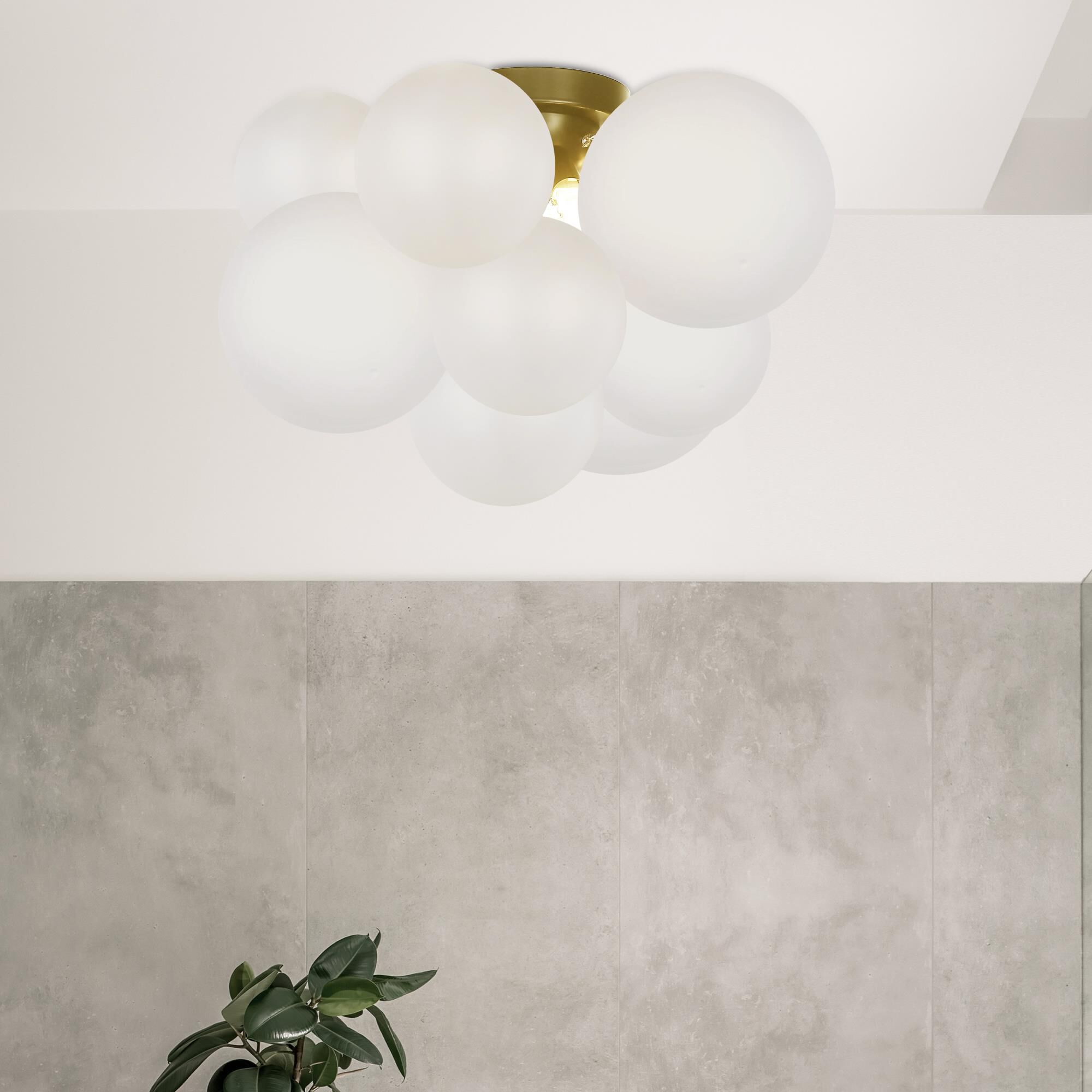Shown in White and Aged Brass finish and White Globe glass
