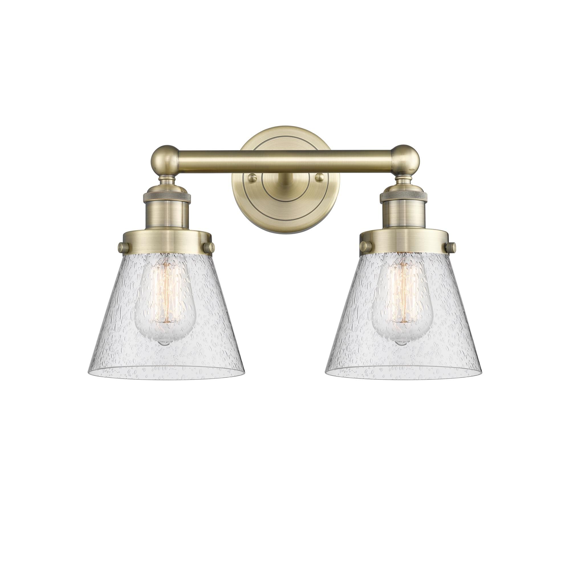Shown in Antique Brass finish and Seedy glass