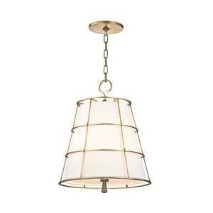 Shown in Aged Brass finish and Linen shade