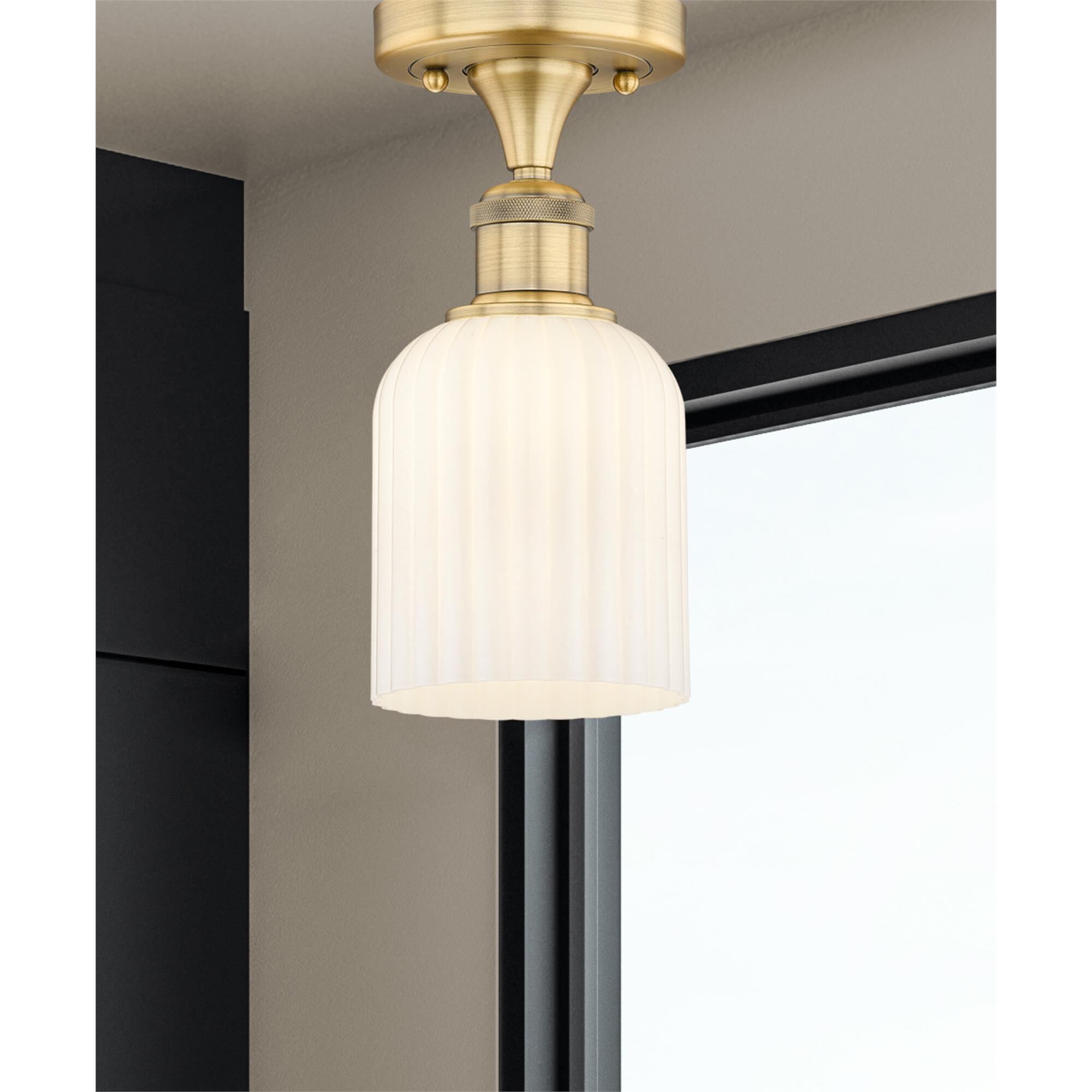 Shown in Brushed Brass finish and Gloss White glass