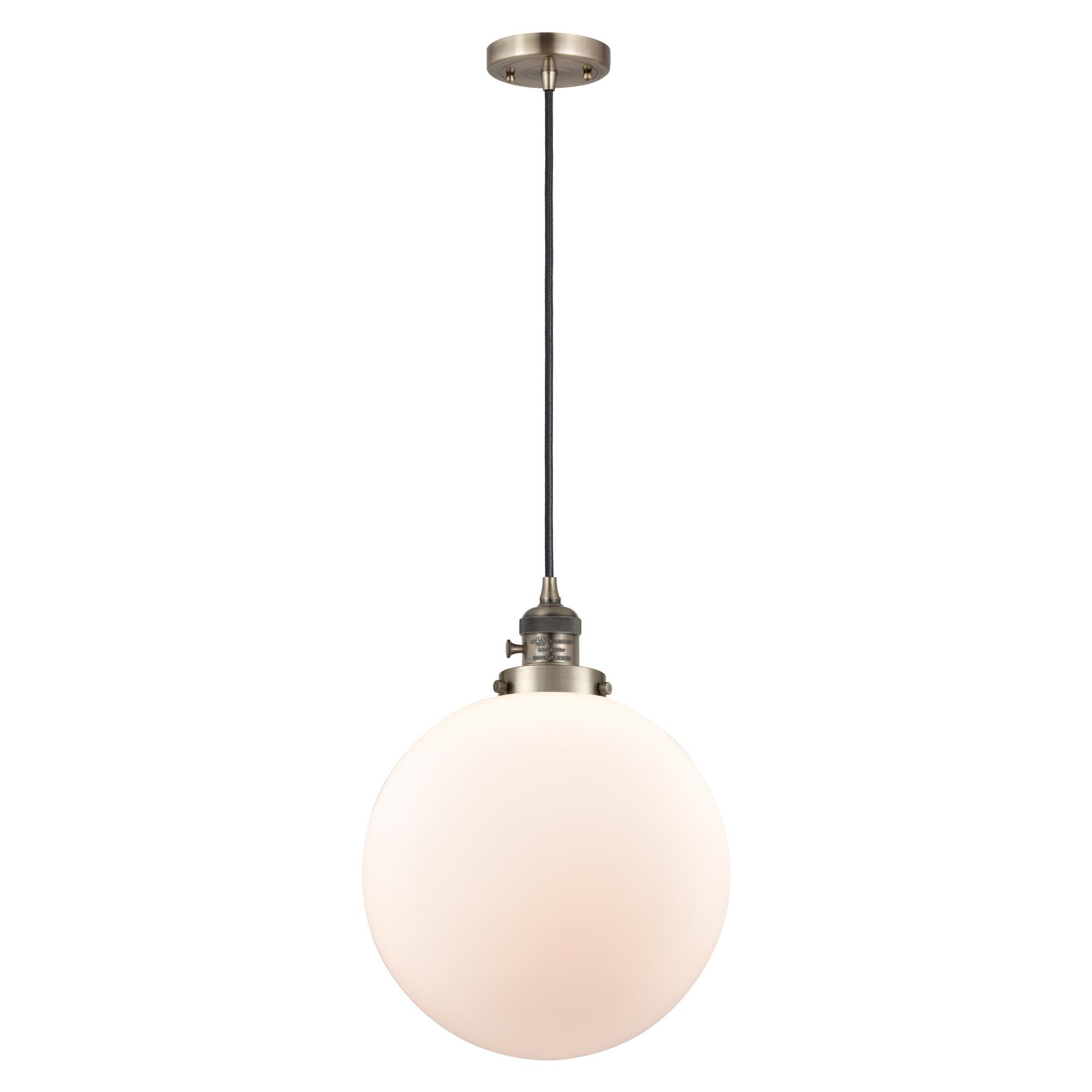 Shown in Antique Brass finish and Matte White Cased glass