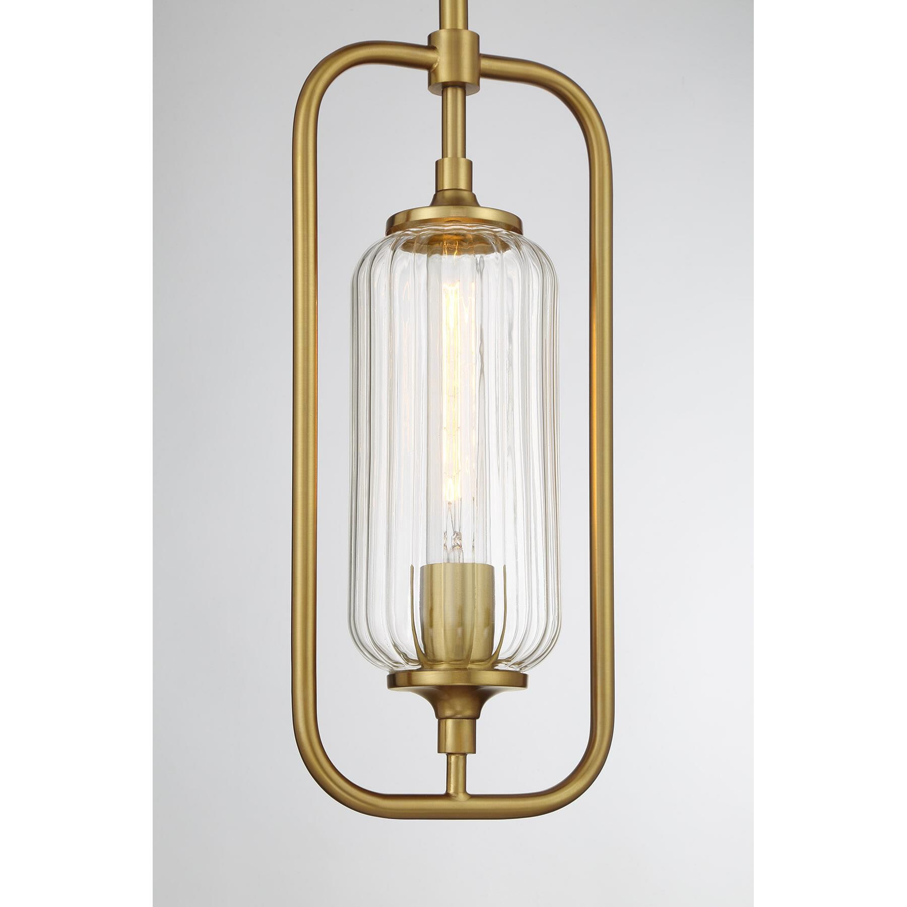 Shown in Warm Brass finish and Clear Ribbed glass