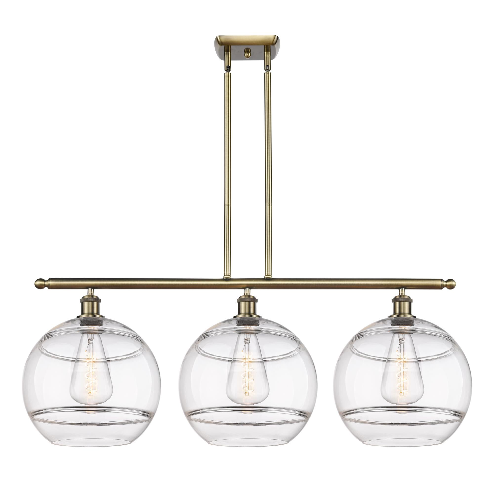Shown in Antique Brass finish and Clear glass