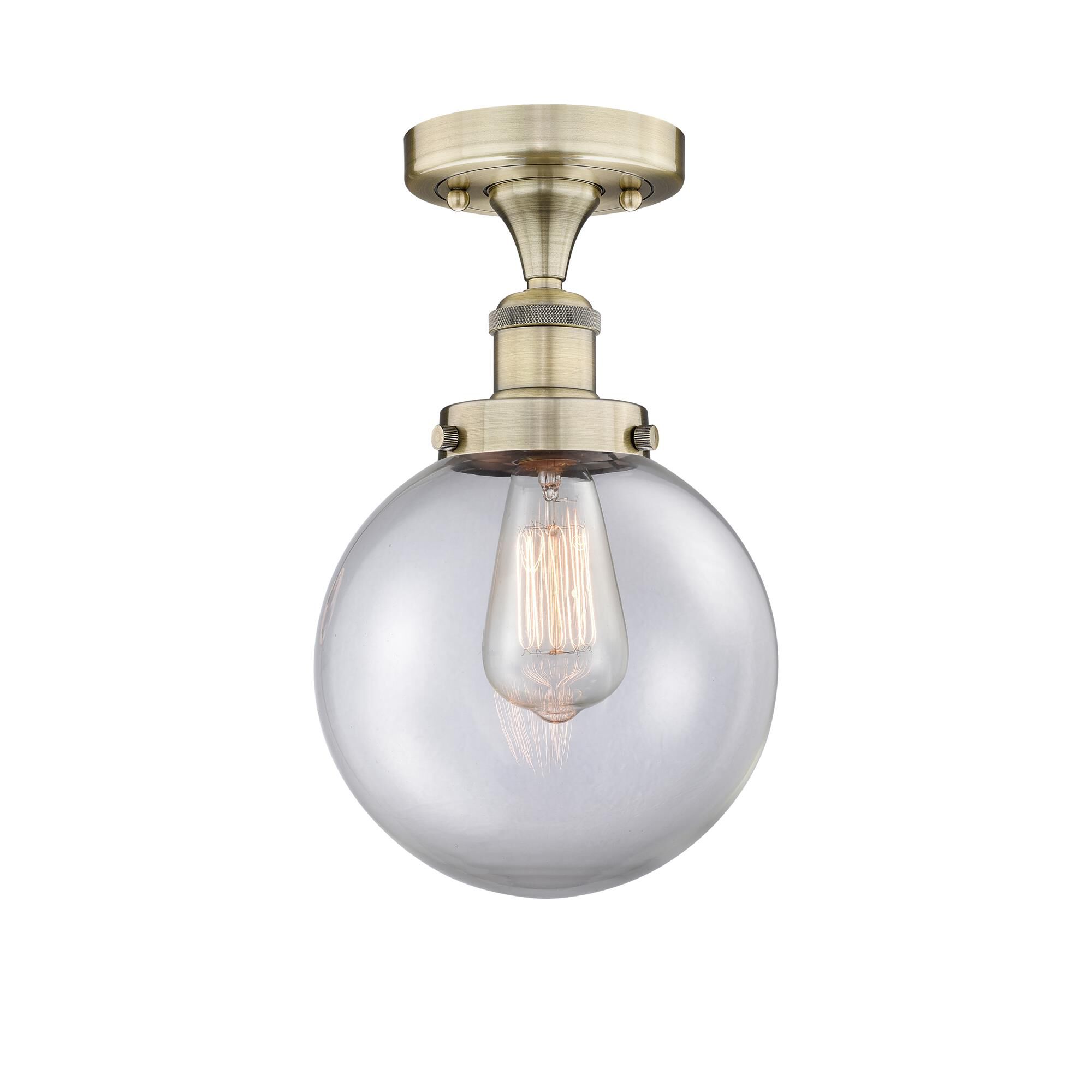 Shown in Antique Brass finish and Clear glass