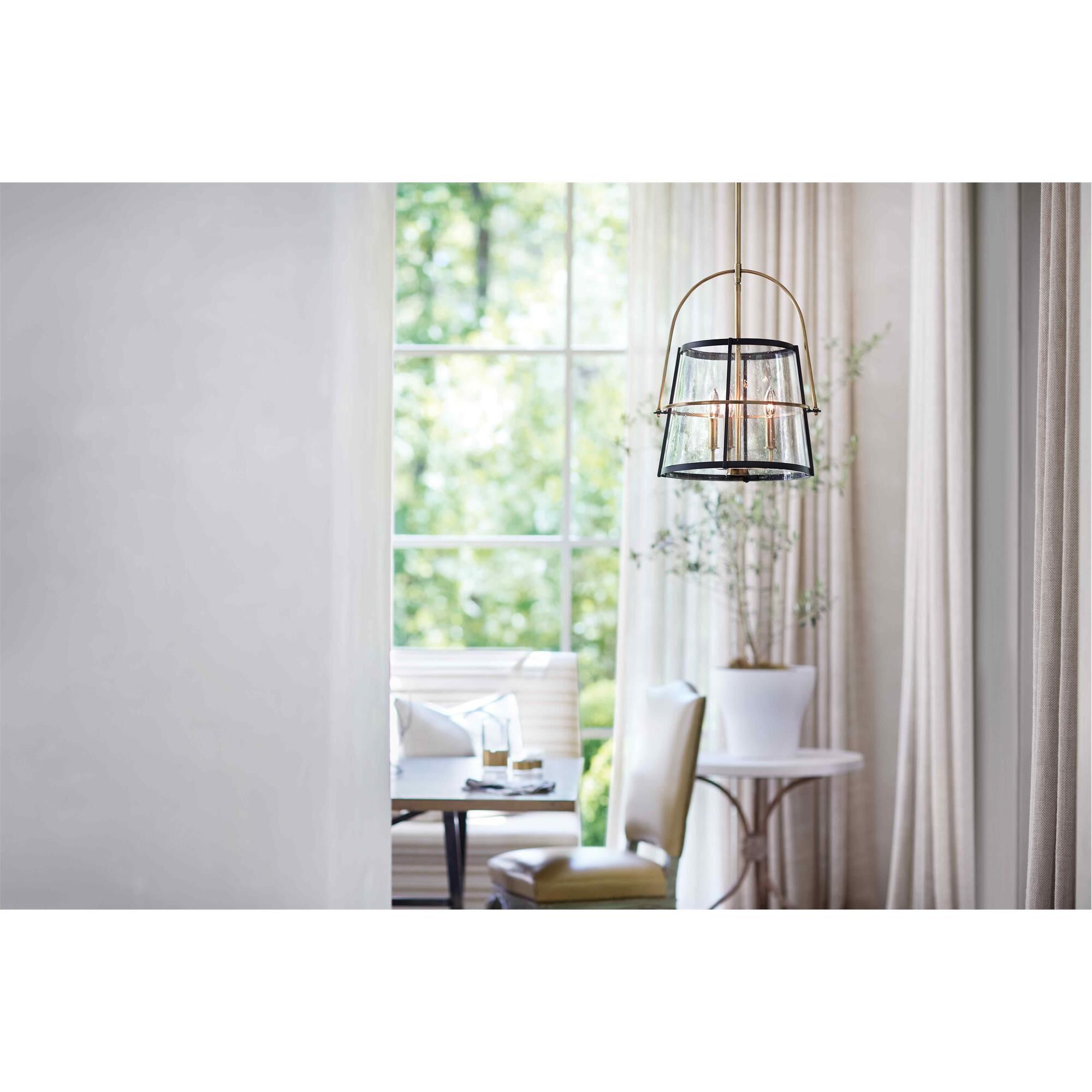 Shown in Heritage Brass finish and Clear Seedy glass and Black accent