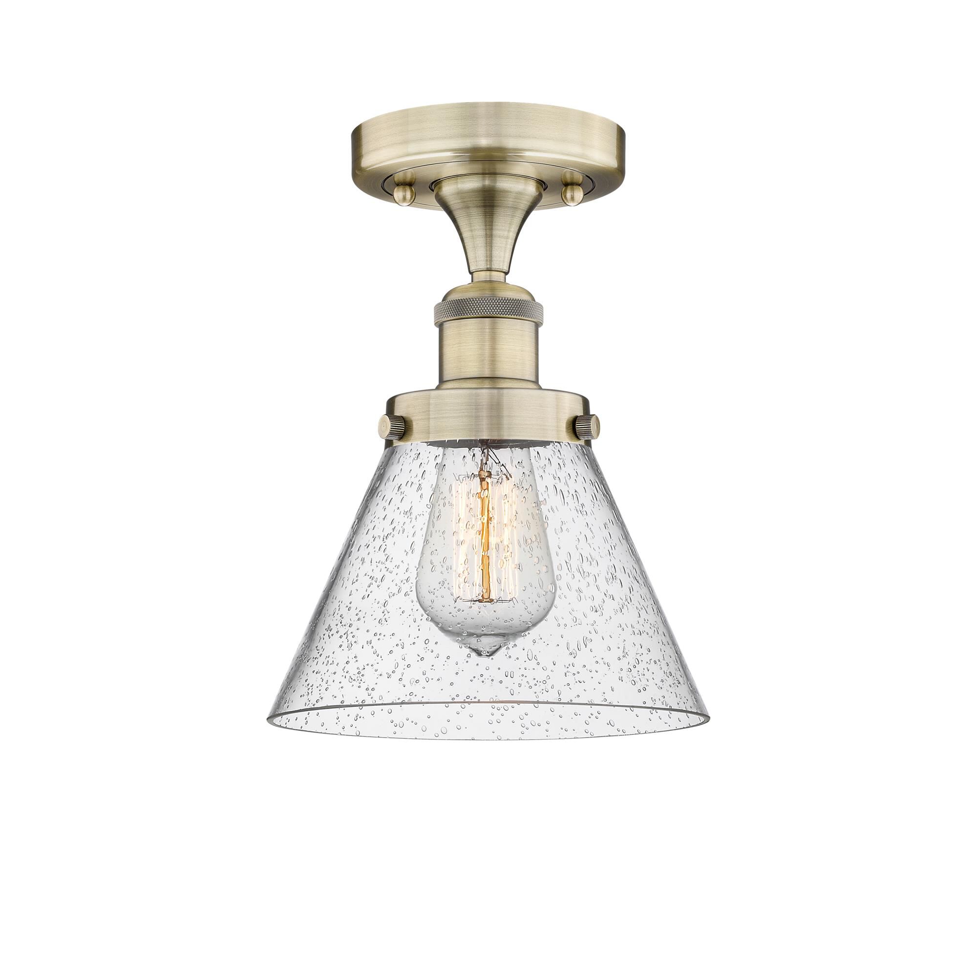 Shown in Antique Brass finish and Seedy glass